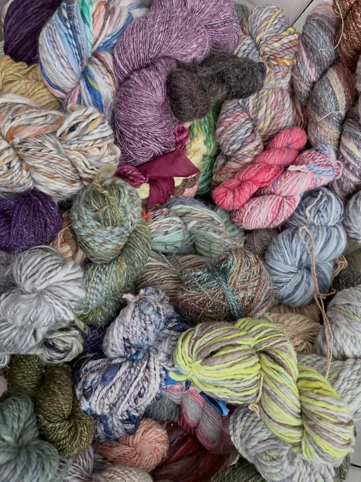 This is a glimpse of my collection of hand spun yarn. Making yarn is so magical and each hank becomes so precious to me I haven&rsquo;t been able to sell them or use them. Every few months I open the bag and just play. Today that is changing. I&rsquo