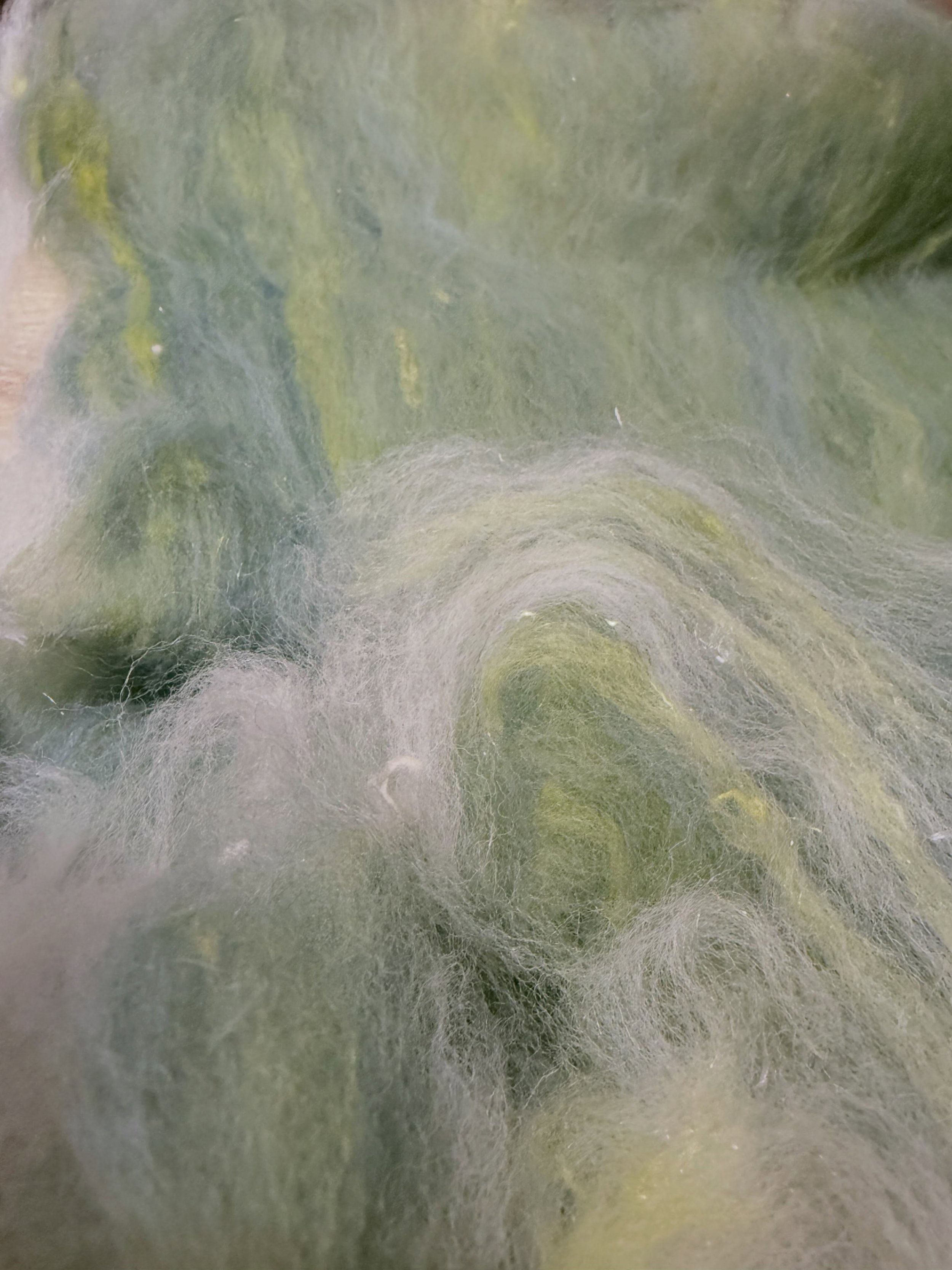 I never tire of the beauty of wool, whether in its natural state or dyed, blended and carded with shiny bits. I see sunshine on a field glistening with morning dew. Art is everywhere as long as we open our hearts and eyes to see it.