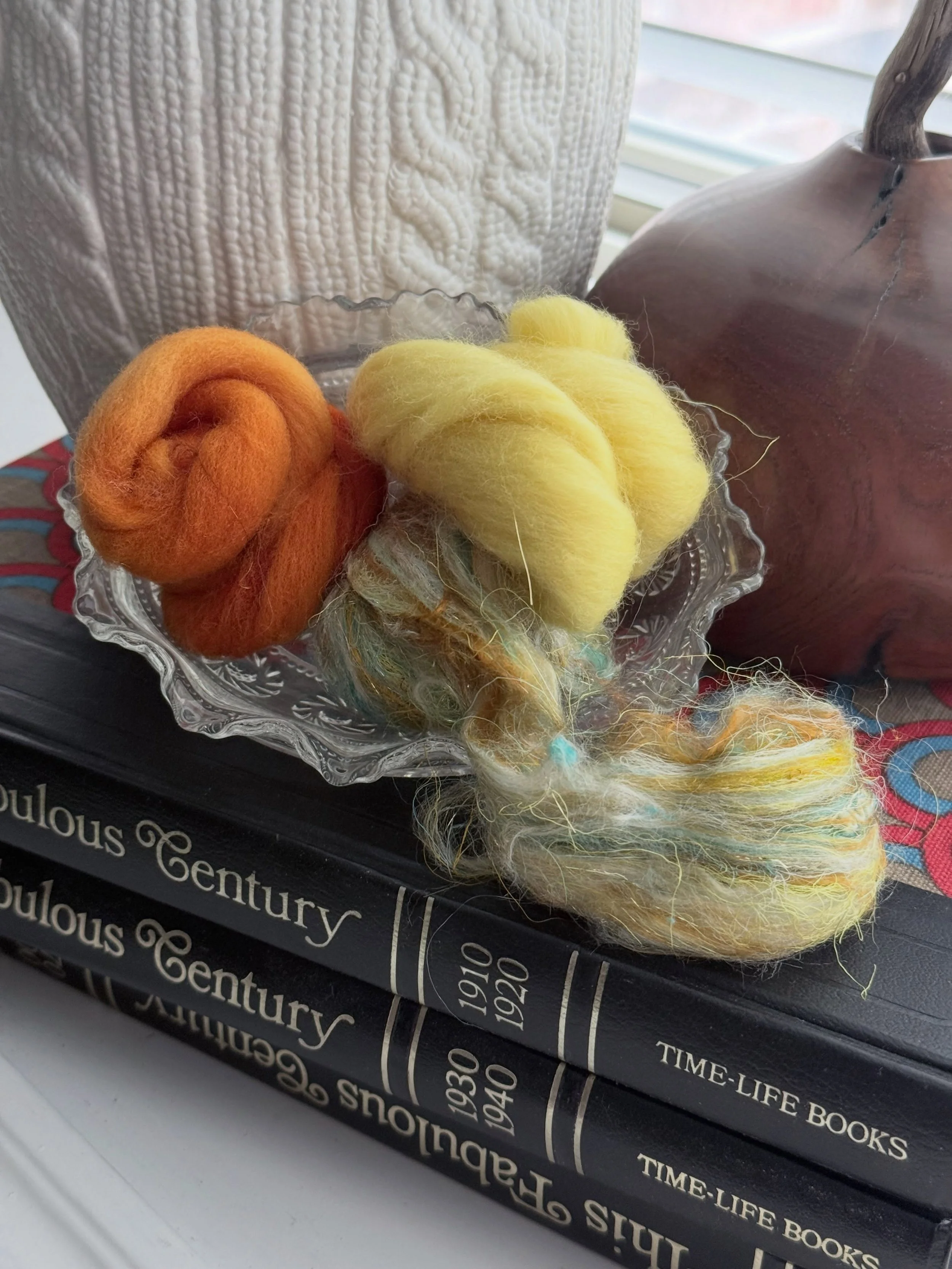Digging back in my photo archives. Life is crazy and I&rsquo;m not creating much at the moment. From clumps of fiber to mini batts to yarn and finally an small piece of crochet art. My favorite process.