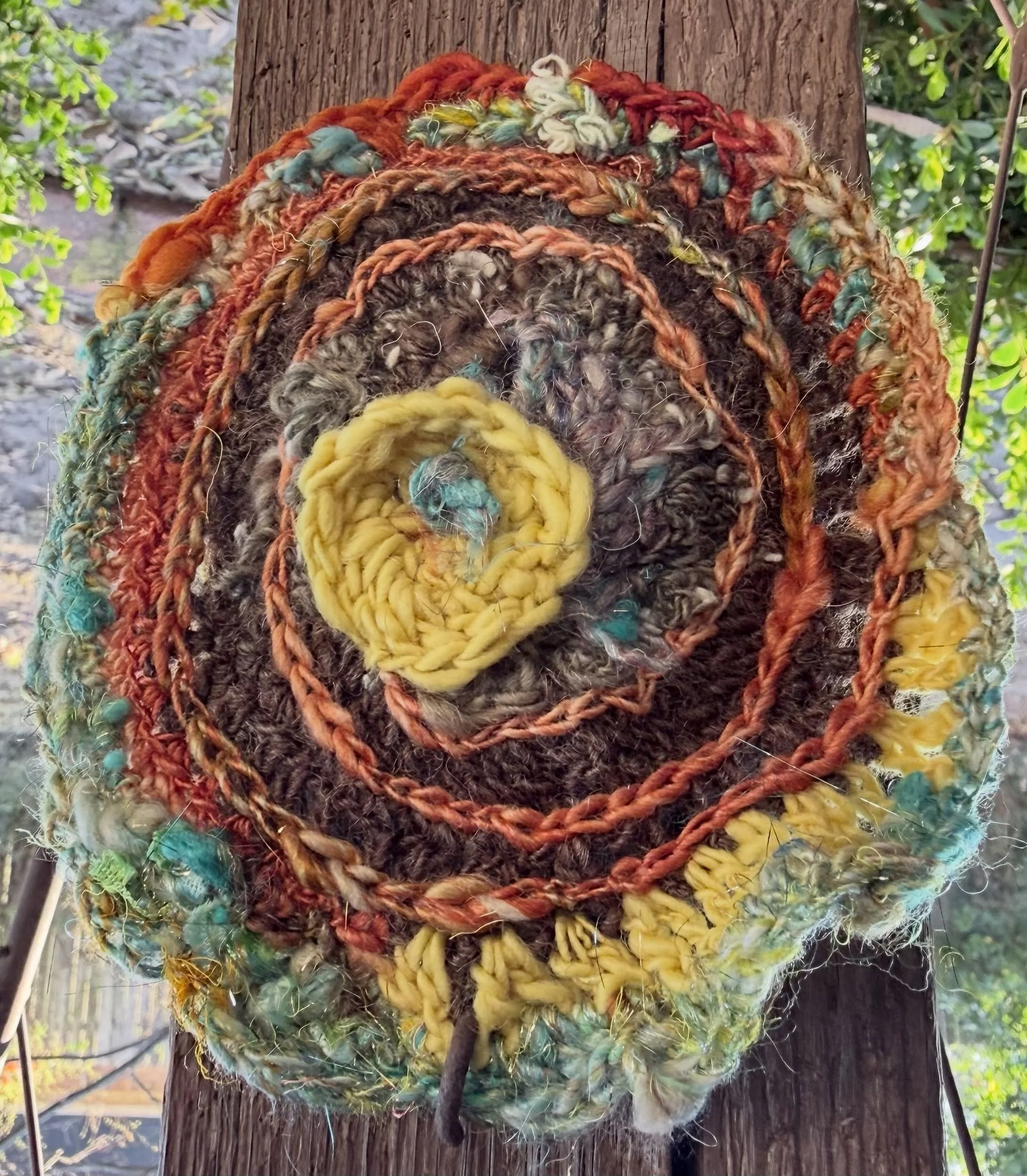 One of the things I love most about life right now is the book club I belong to with two dear friends. We are making a crochet granny square based on each book we read. I also made this freeform art piece with hand spun yarn I had spun. I absolute lo
