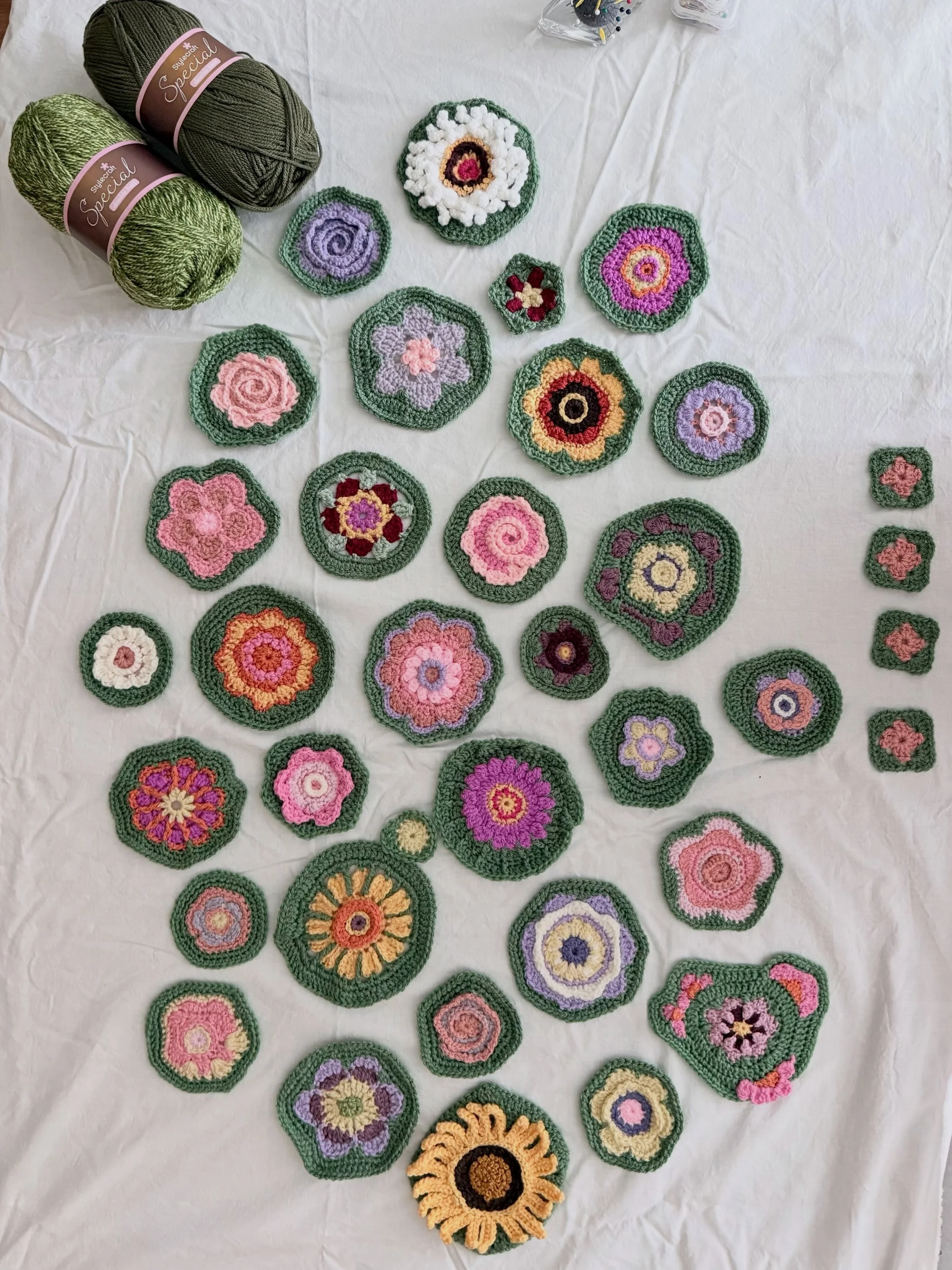 This is the next stage in my flower garden blanket. I want this to be very organic so the joining will be fluid around flowers and leaves (not made yet). I have two additional greens I will be using for shading and depth. For contrast the leaves will
