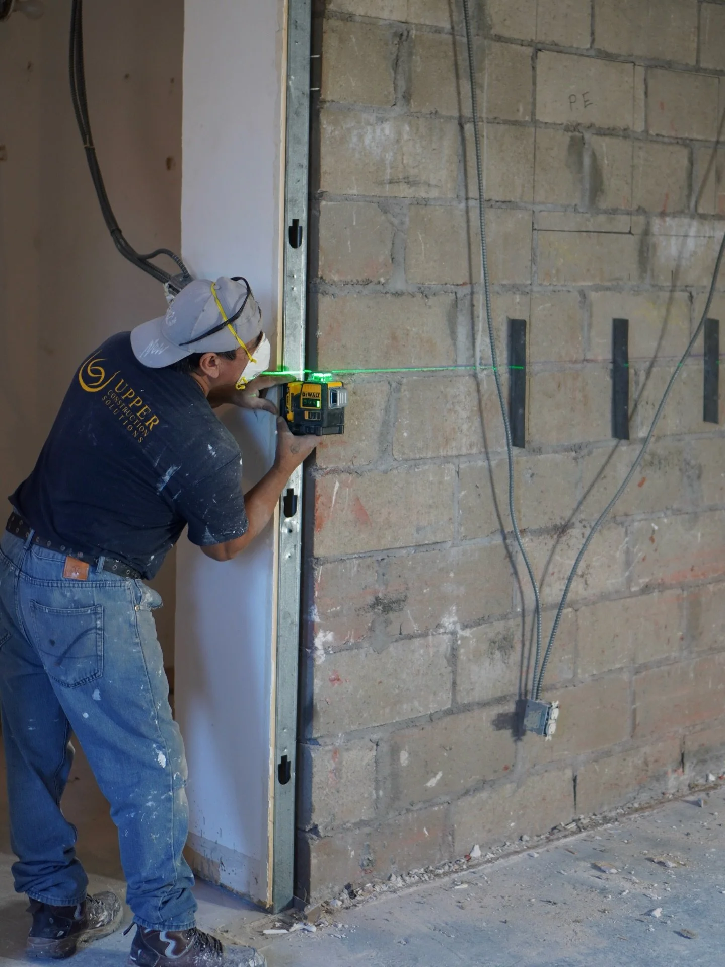 Is Manny checking elevations in what will be the kitchen OR is he just playing laser tag? 🤨

But in all seriousness &mdash; getting the datum line right is what keeps your cabinets aligned, your tile straight, and your finishes flawless.