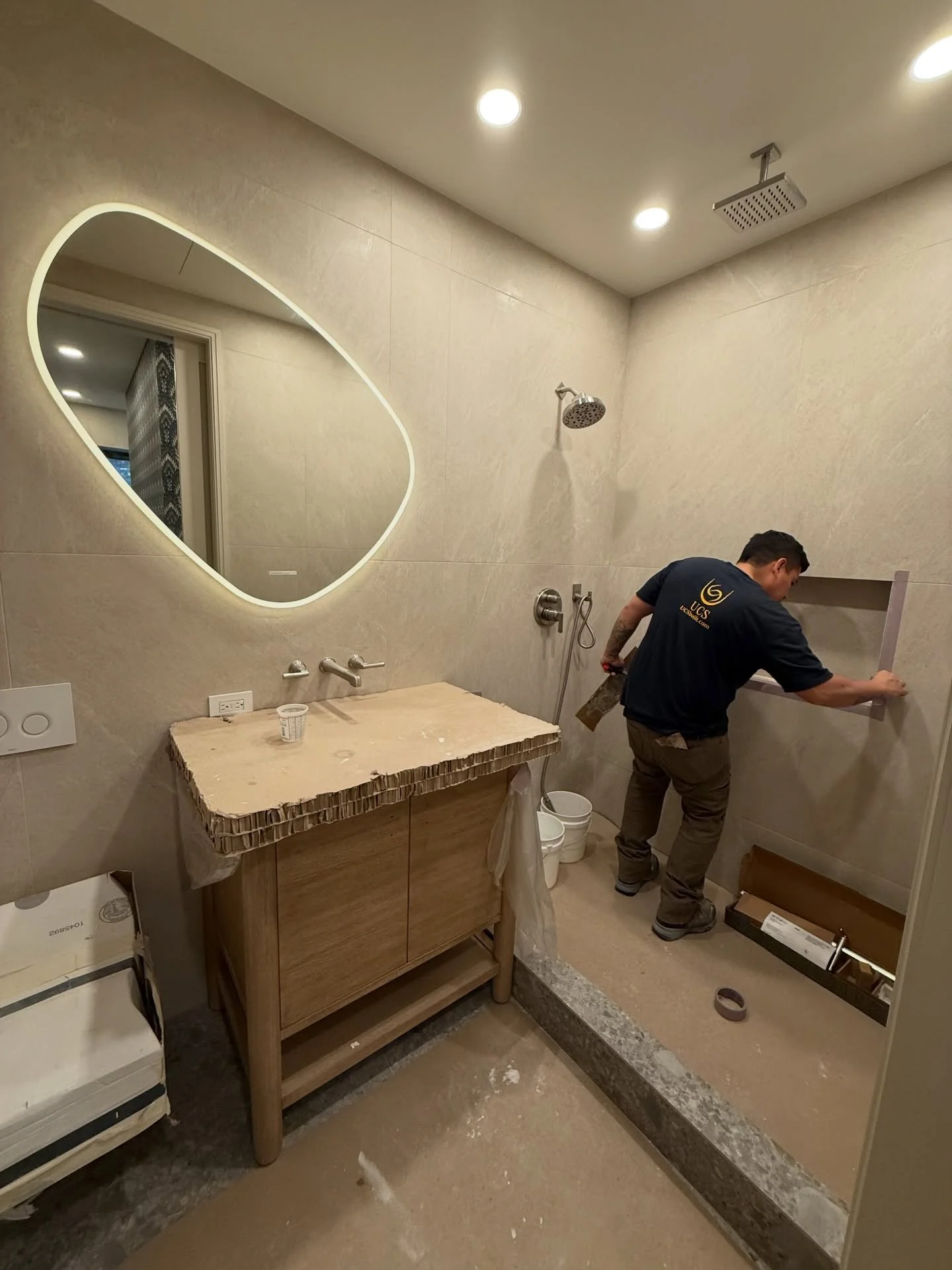 This bathroom is still in progress, but details like the asymmetrical backlit mirror already bring a quiet sense of luxury and softness to the space.

Thoughtful design lives in the details &mdash; from layout to lighting, and everything in between.
