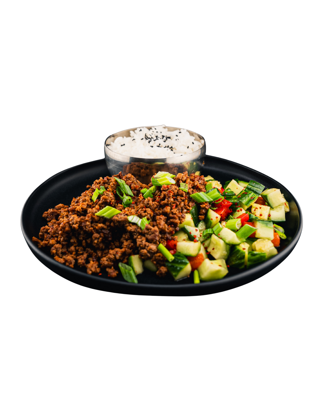 Black plate with cooked ground beef, diced cucumber salad, and a small bowl of rice topped with black sesame seeds.