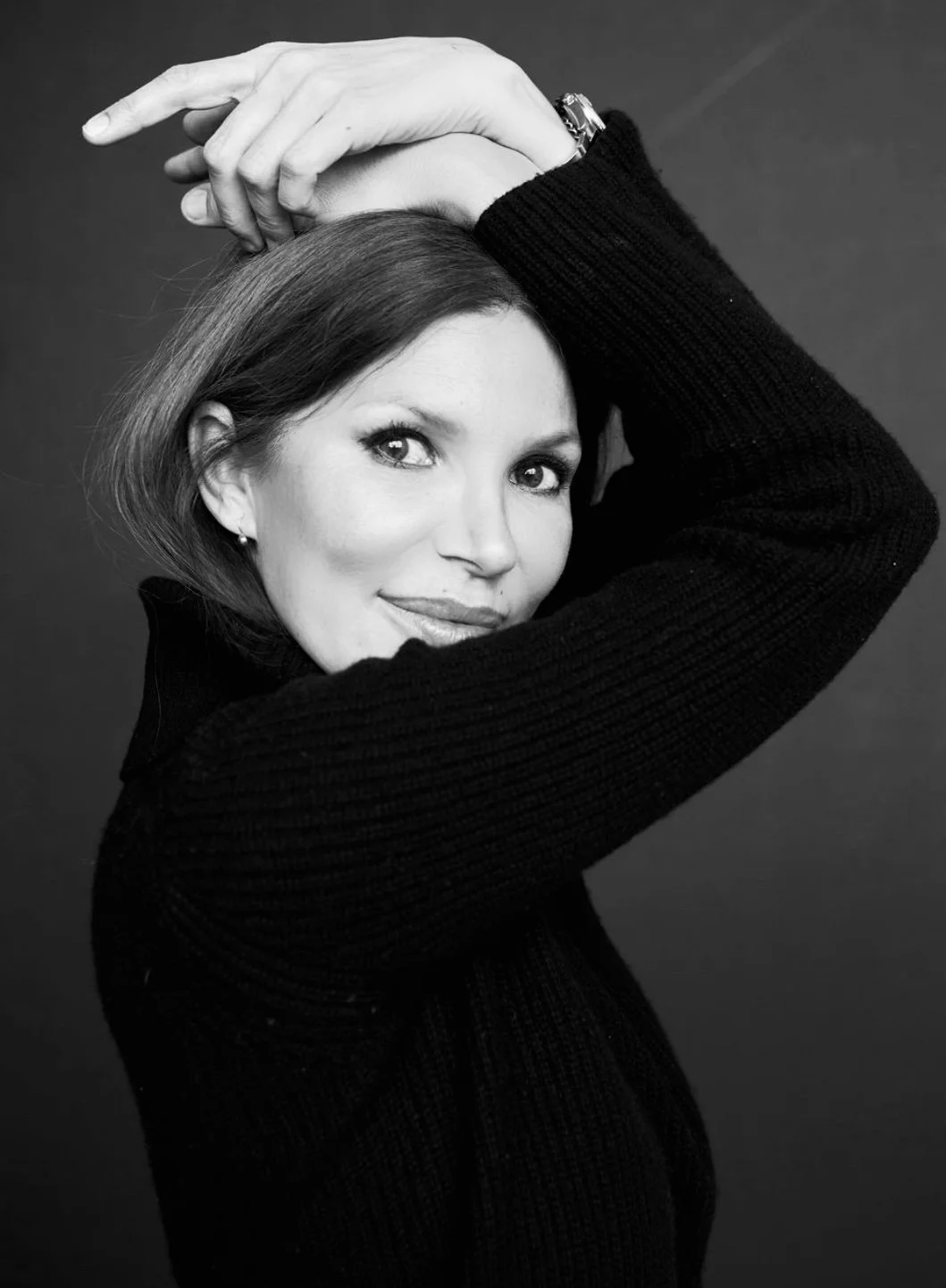 Black and white editorial portrait of Anna Nenoiu, celebrity hair and makeup artist and founder of The Beauty Confidante