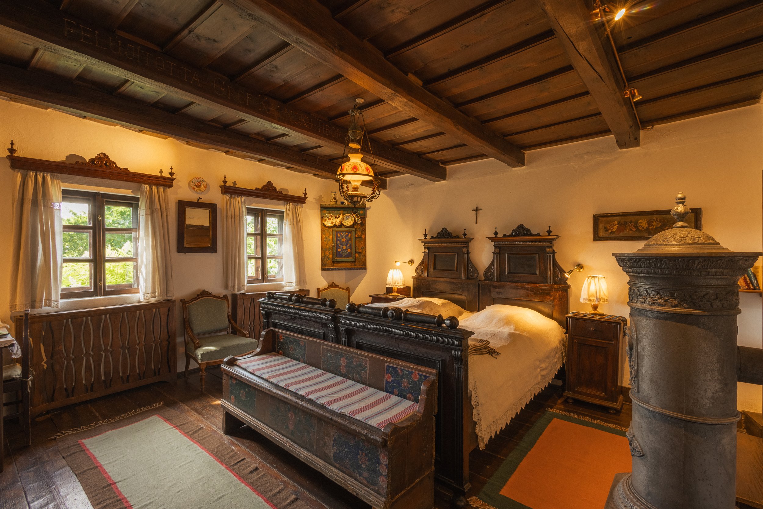 A guesthouse bedroom furnished with antique Transylvanian decor