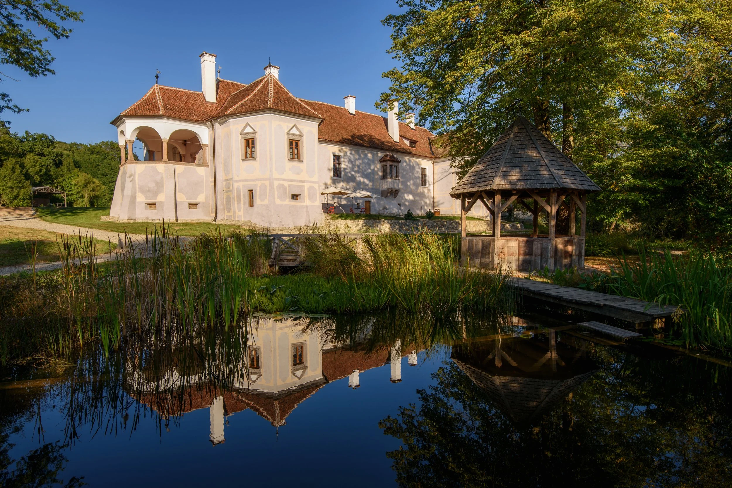 Grounds and garden with the Kalnoky castle in the background in Miclisoara, Transylvania
