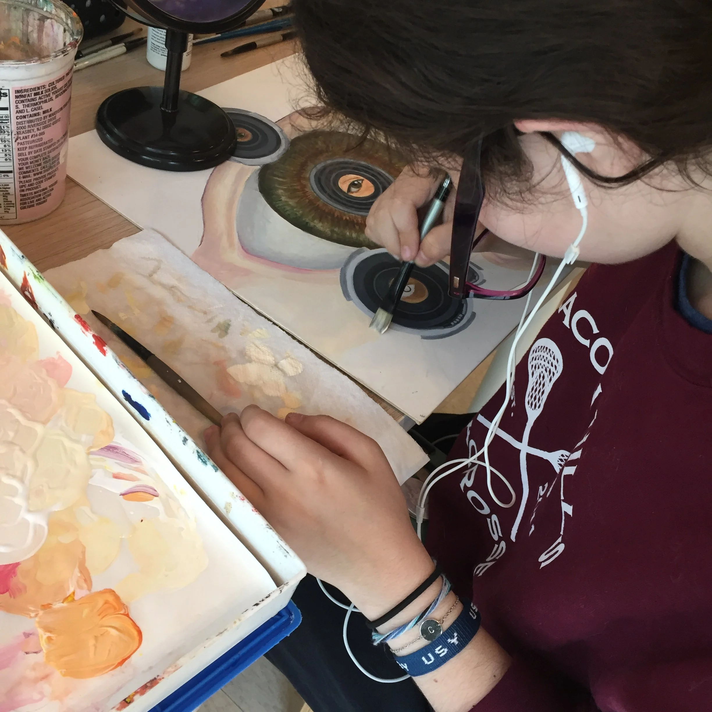 Teen Student Workin on Self Portrait Painting