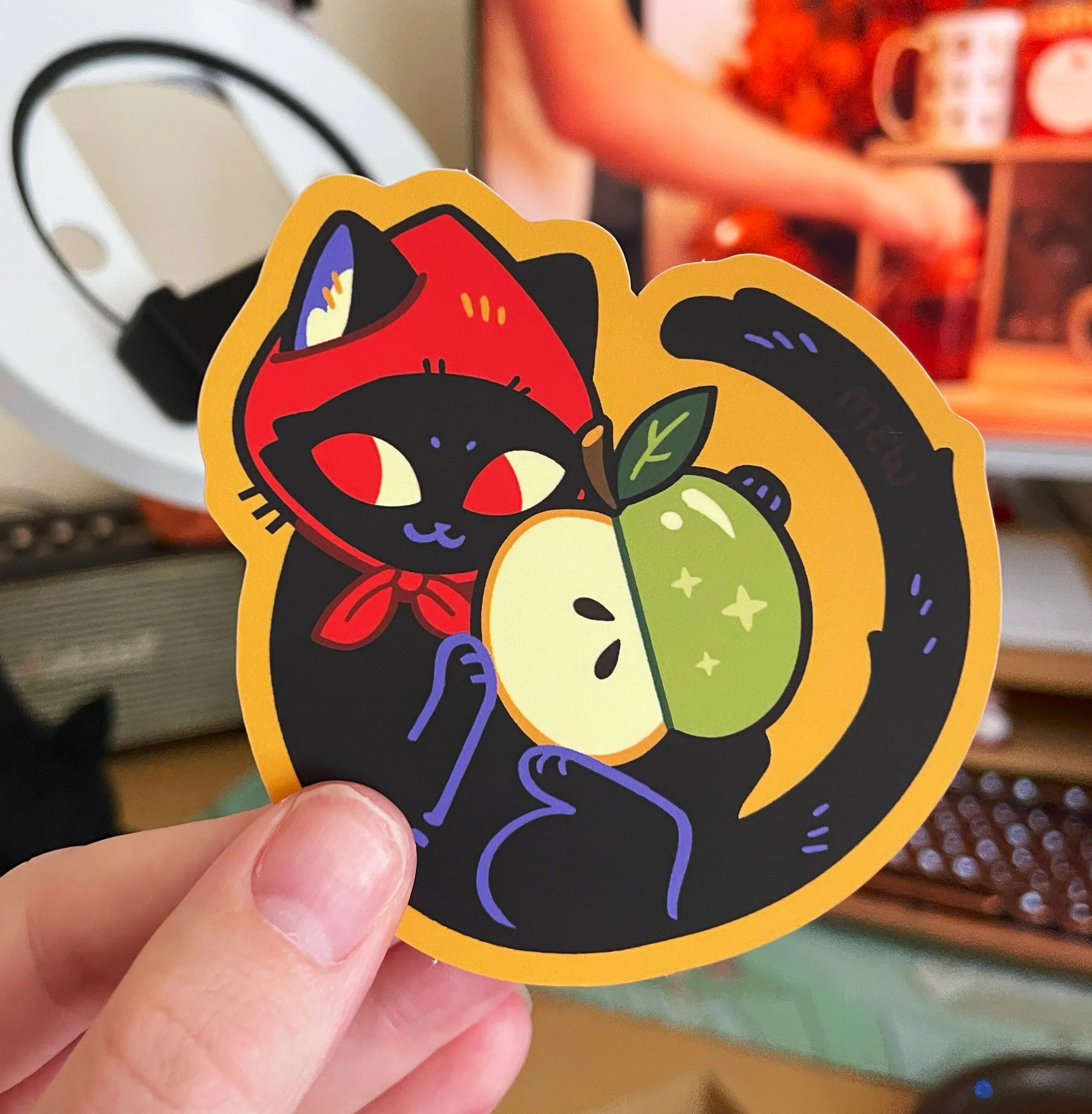 Apple Cat Sticker Photo held.jpg