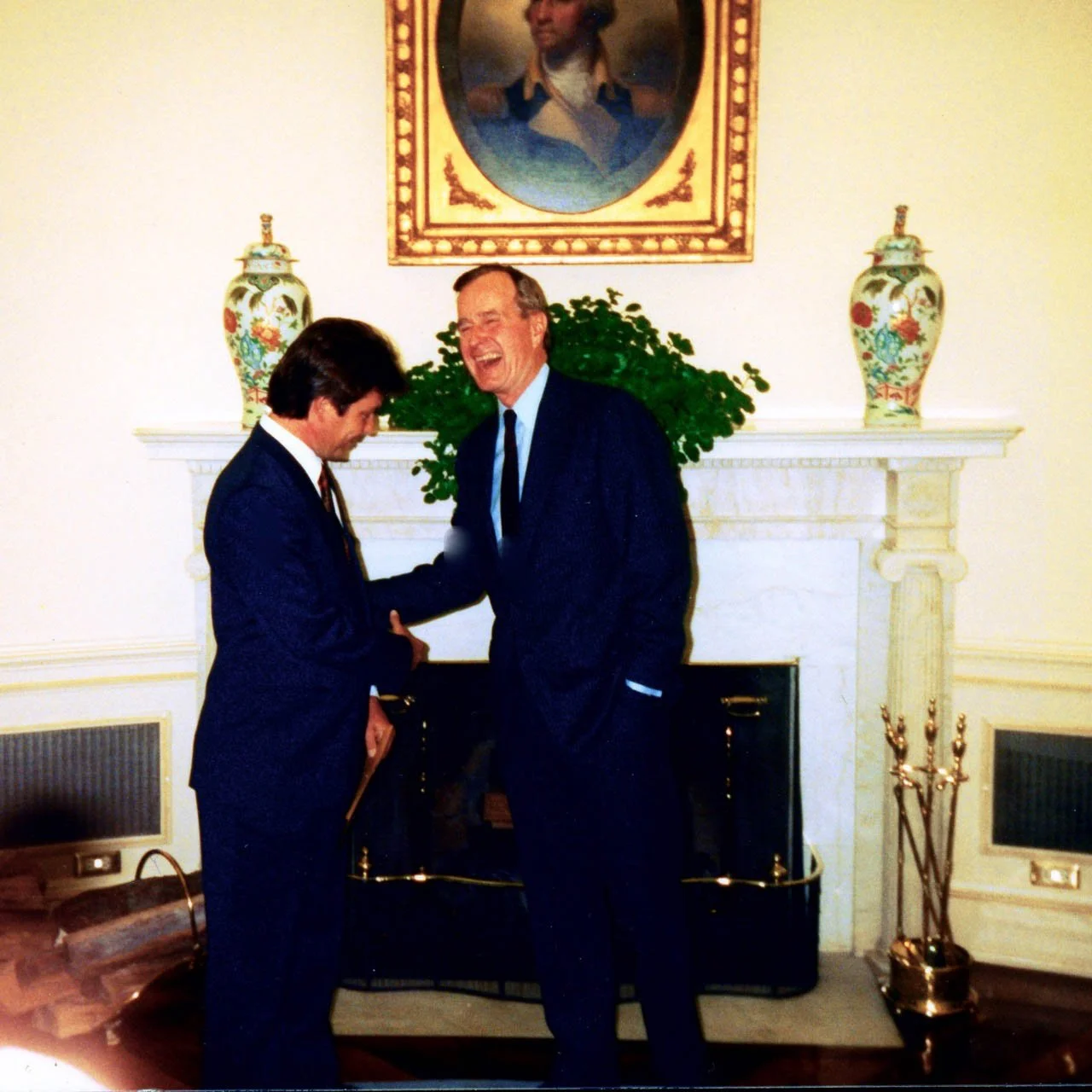 President George HW Bush congratulating Paul on winning a White House News Photographers Award