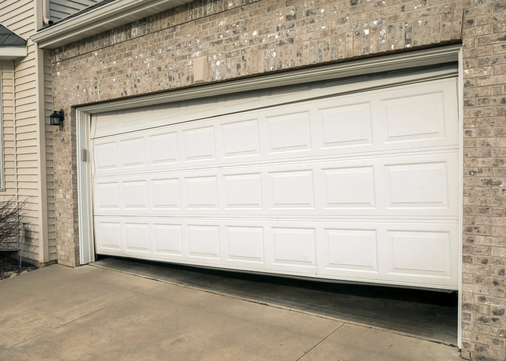 Garage door repair service fixing broken springs and door alignment by Reyes Garage Door LLC