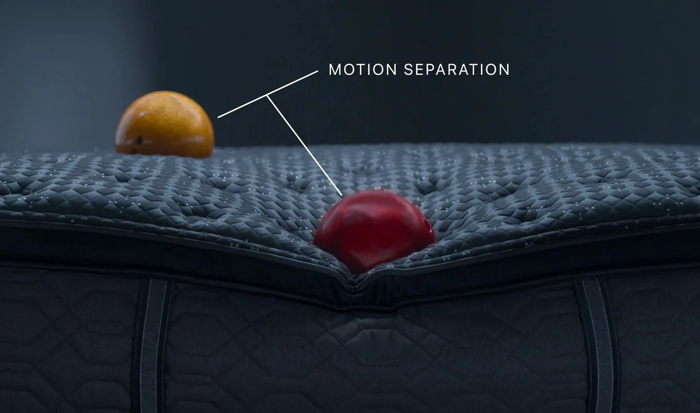 Two apples, one red and one yellow, placed on a textured surface with motion separation annotation pointing to the red apple.