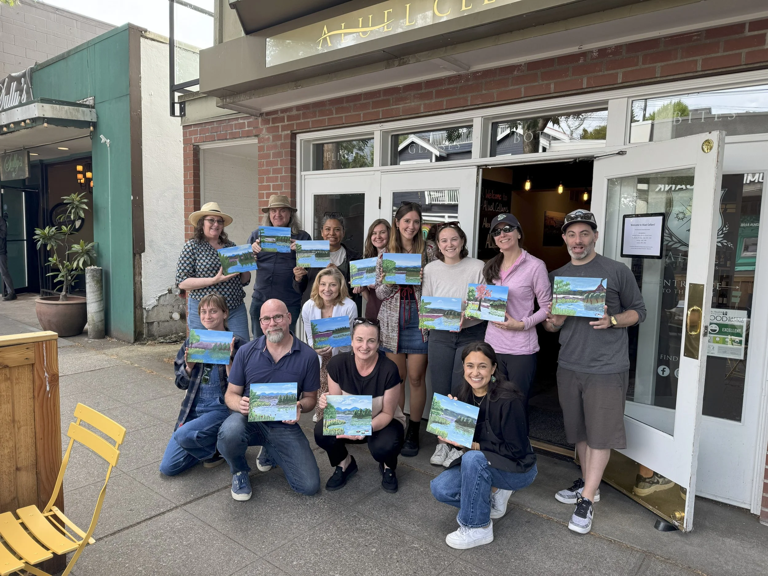 Paint and sip class led by Amira Elsokkary in Queen Anne, Seattle, guests painting with wine outdoors