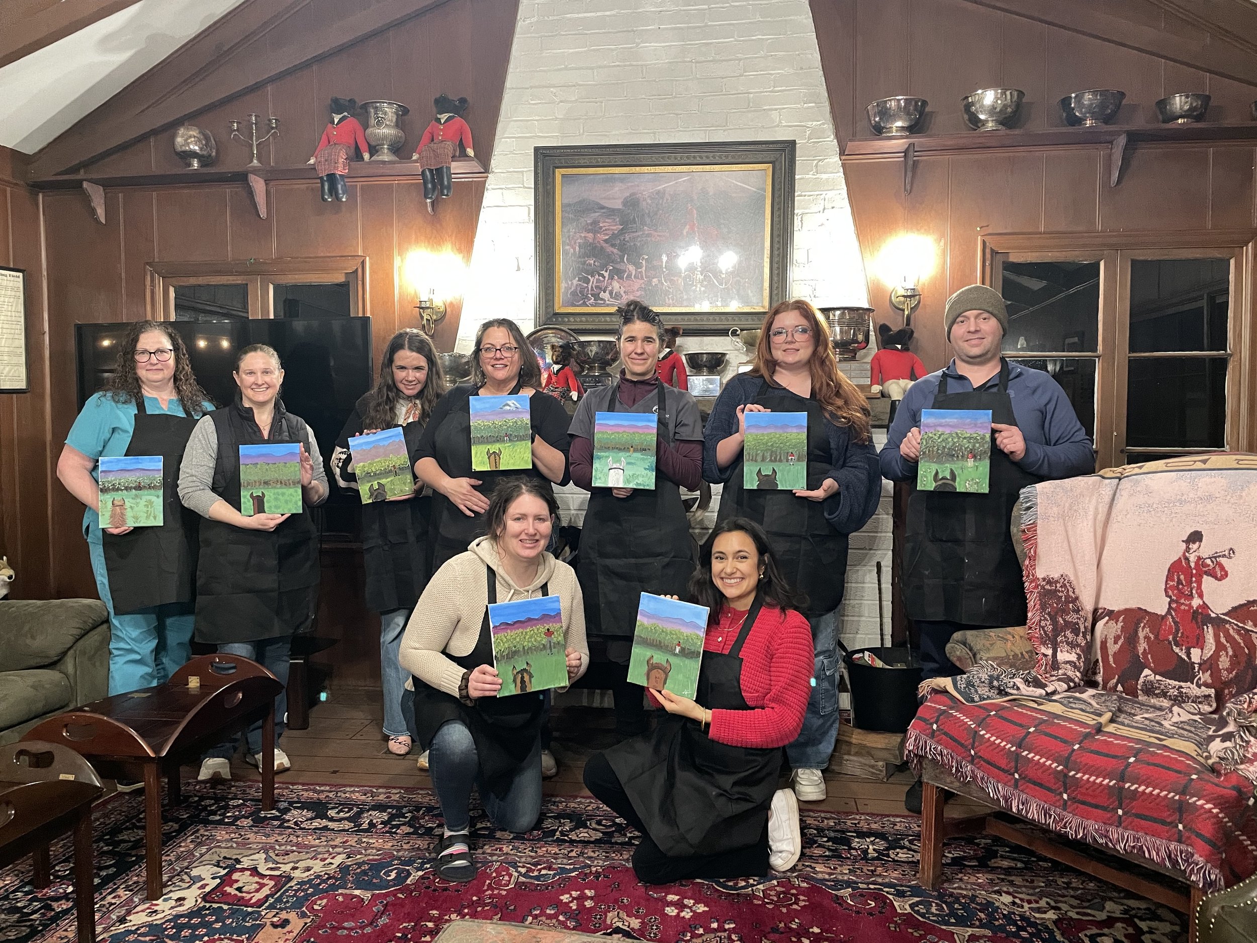 Private paint and sip class led by Amira Elsokkary in Lakewood, WA, guests paint with wine.
