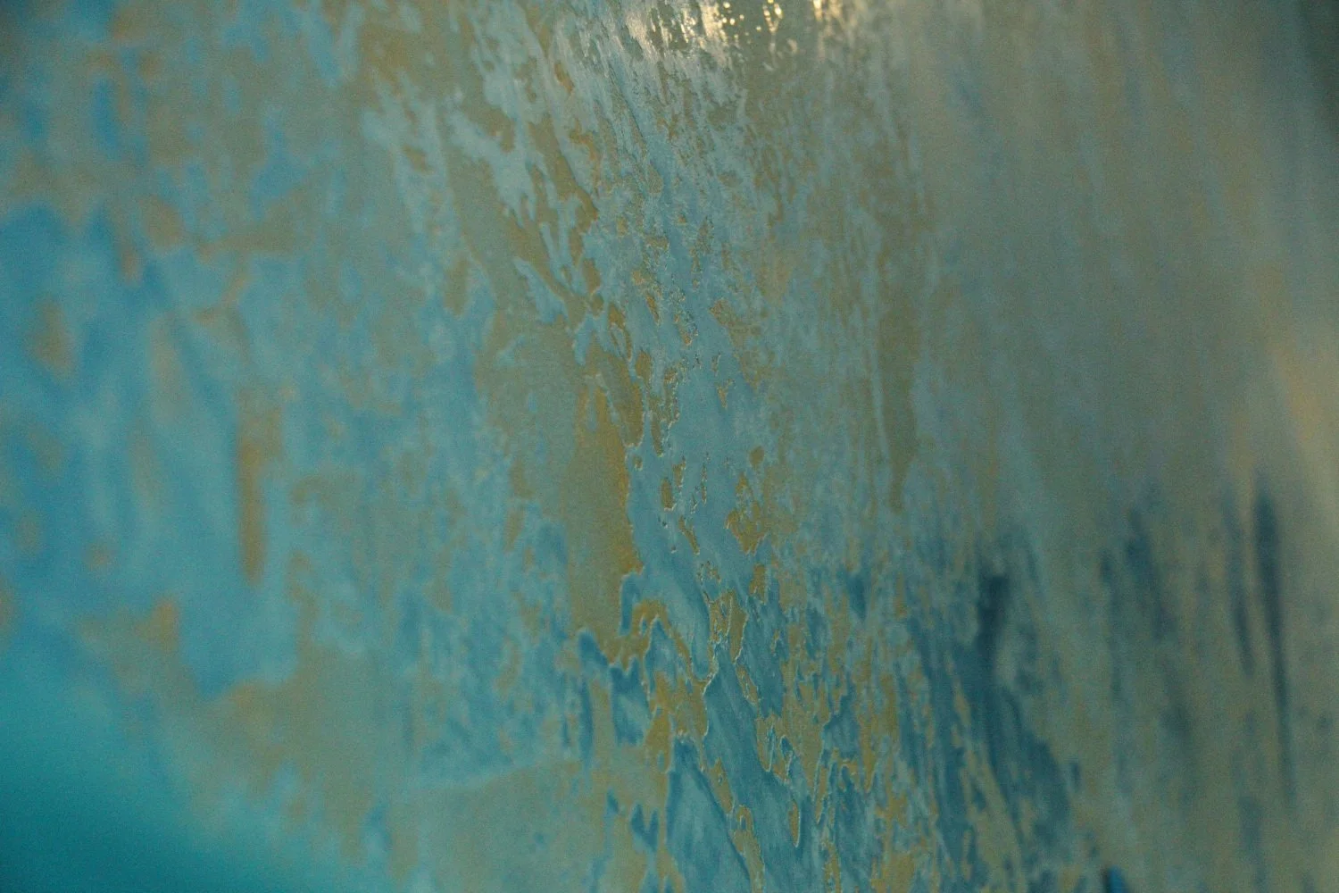 Plastering texture close-up gold and blue hues.jpg