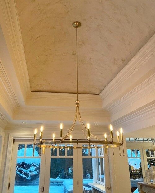 This ceiling finish is lime plaster pearl with custom gold custom woven throughout.  Carrera plaster was the choice for this incredibly technical and difficult concave dinning room ceiling in West Vancouver 

This finish required a 5 coat application