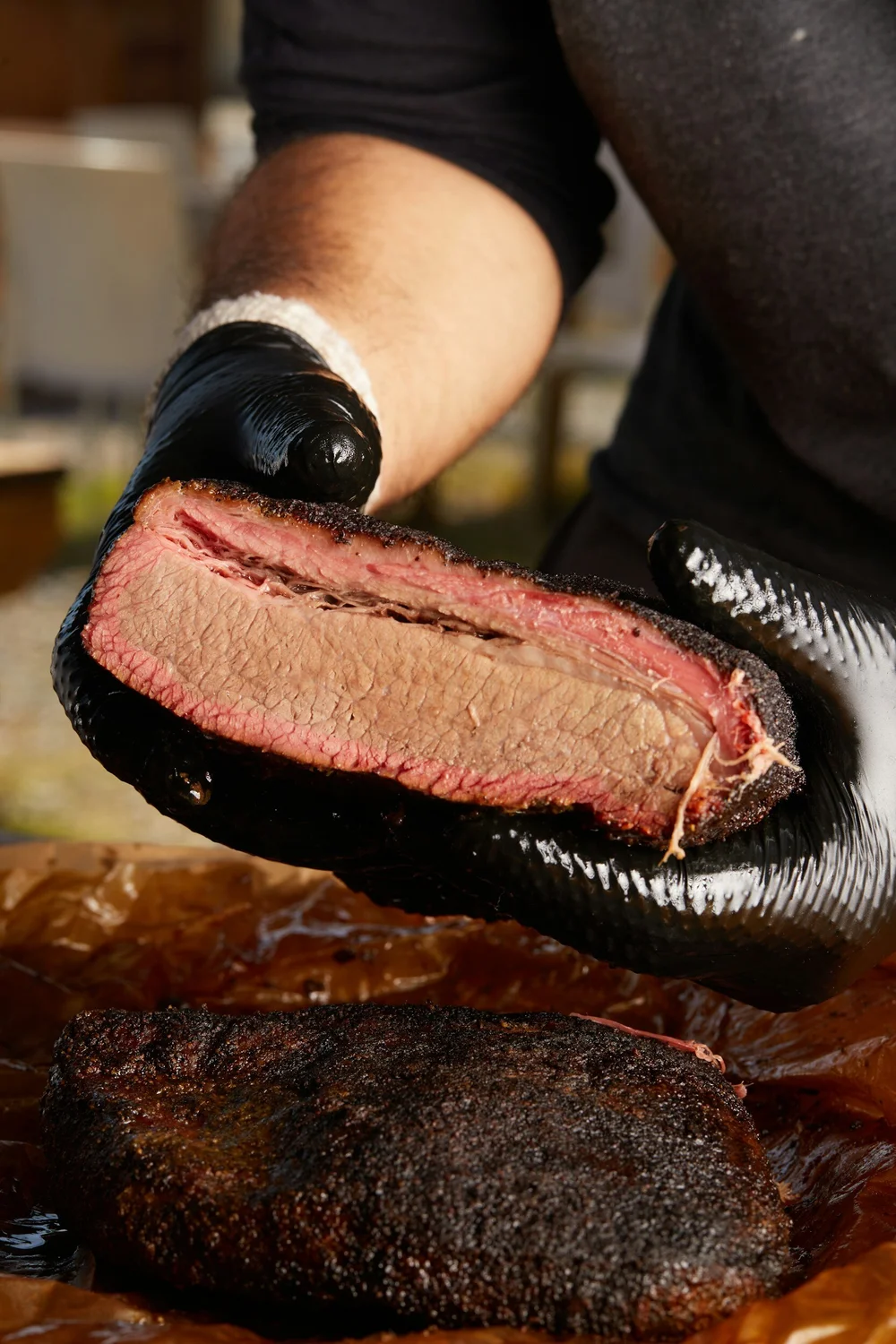Cali Porker brisket showing its bark and pink smoke ring