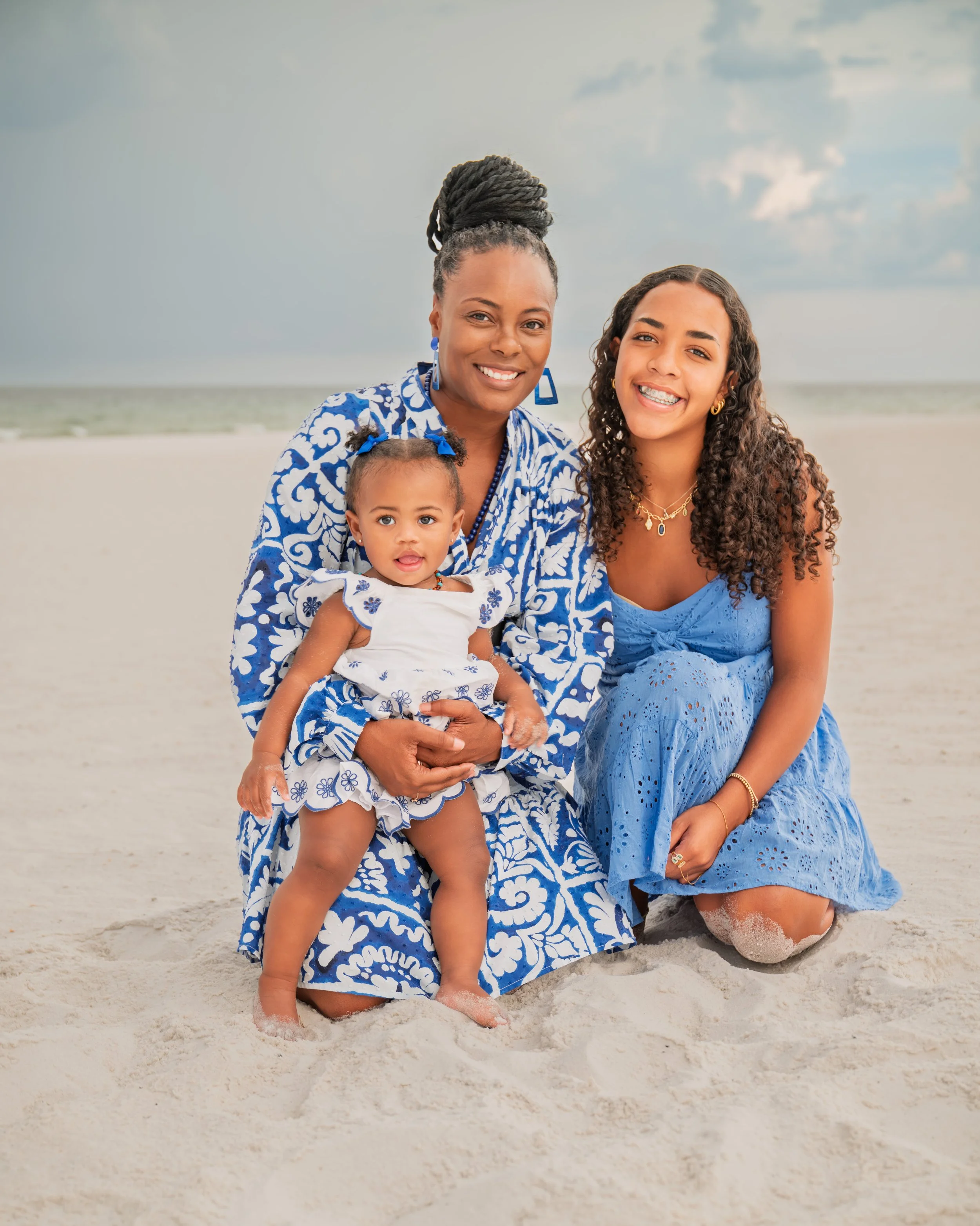 Mother and daughters pose during their family portrait session in Navarre, FL. 