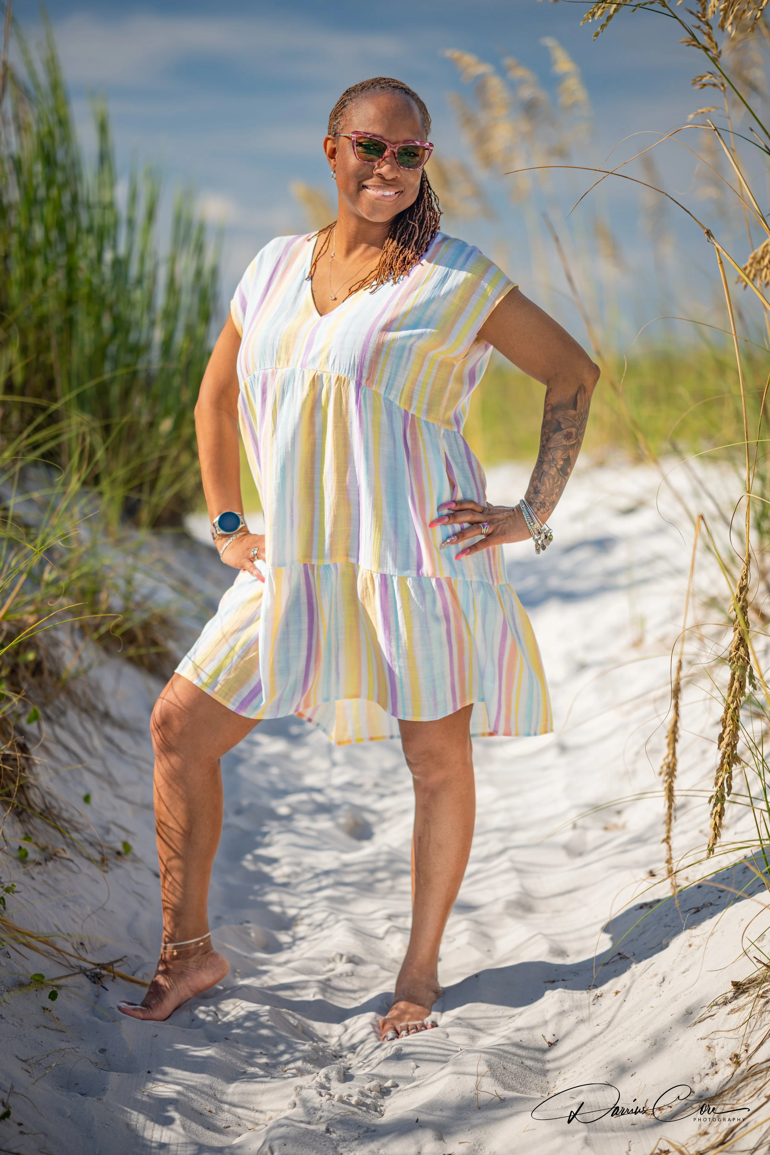 Woman posing for her portrait on the beach