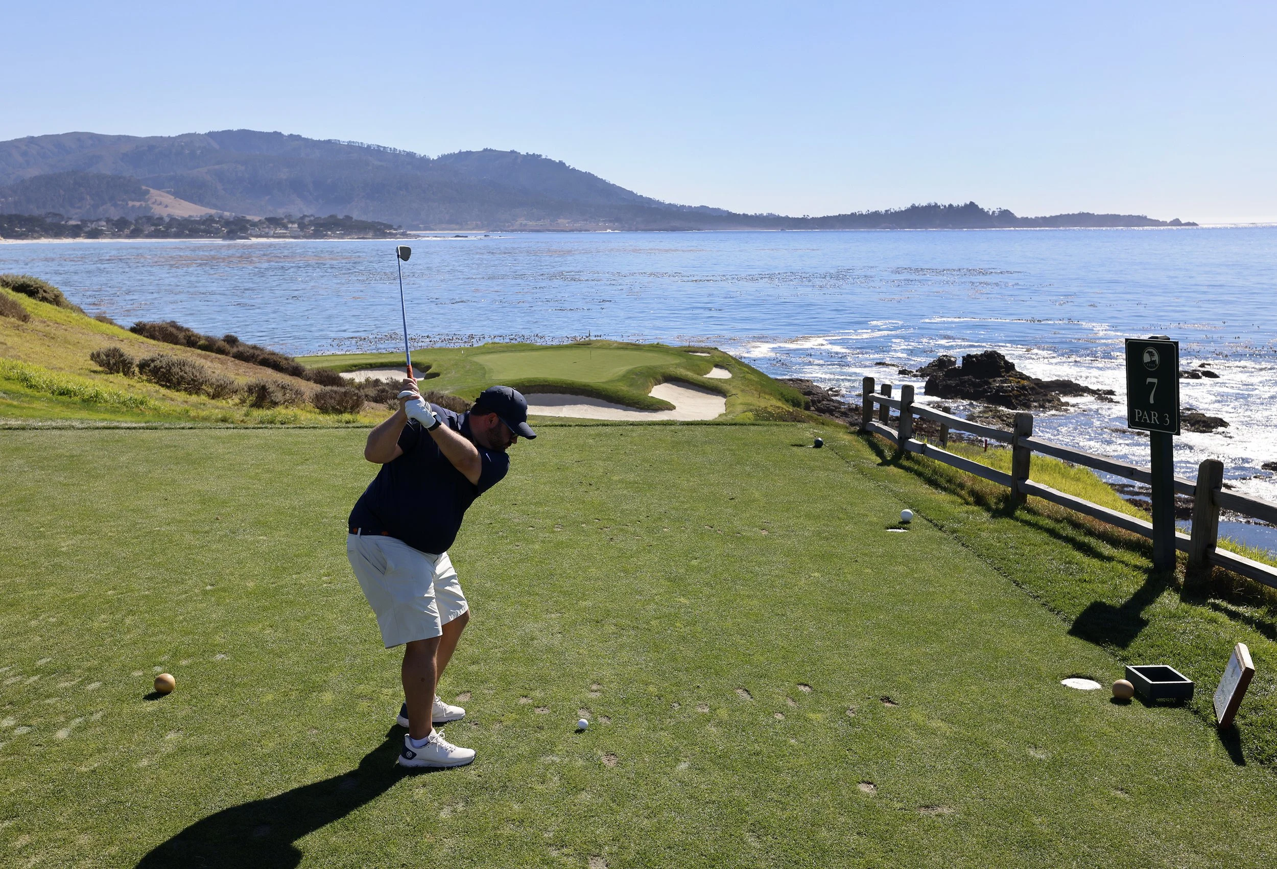 A golfer tees off on Hole 7 at pebble Beach golf links