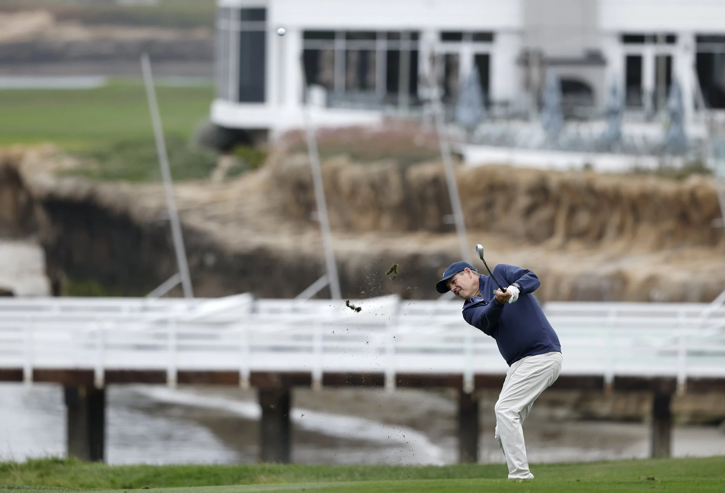 A golfer hits the ball from the fairway of the 5th at Pebble BEach Golf Links