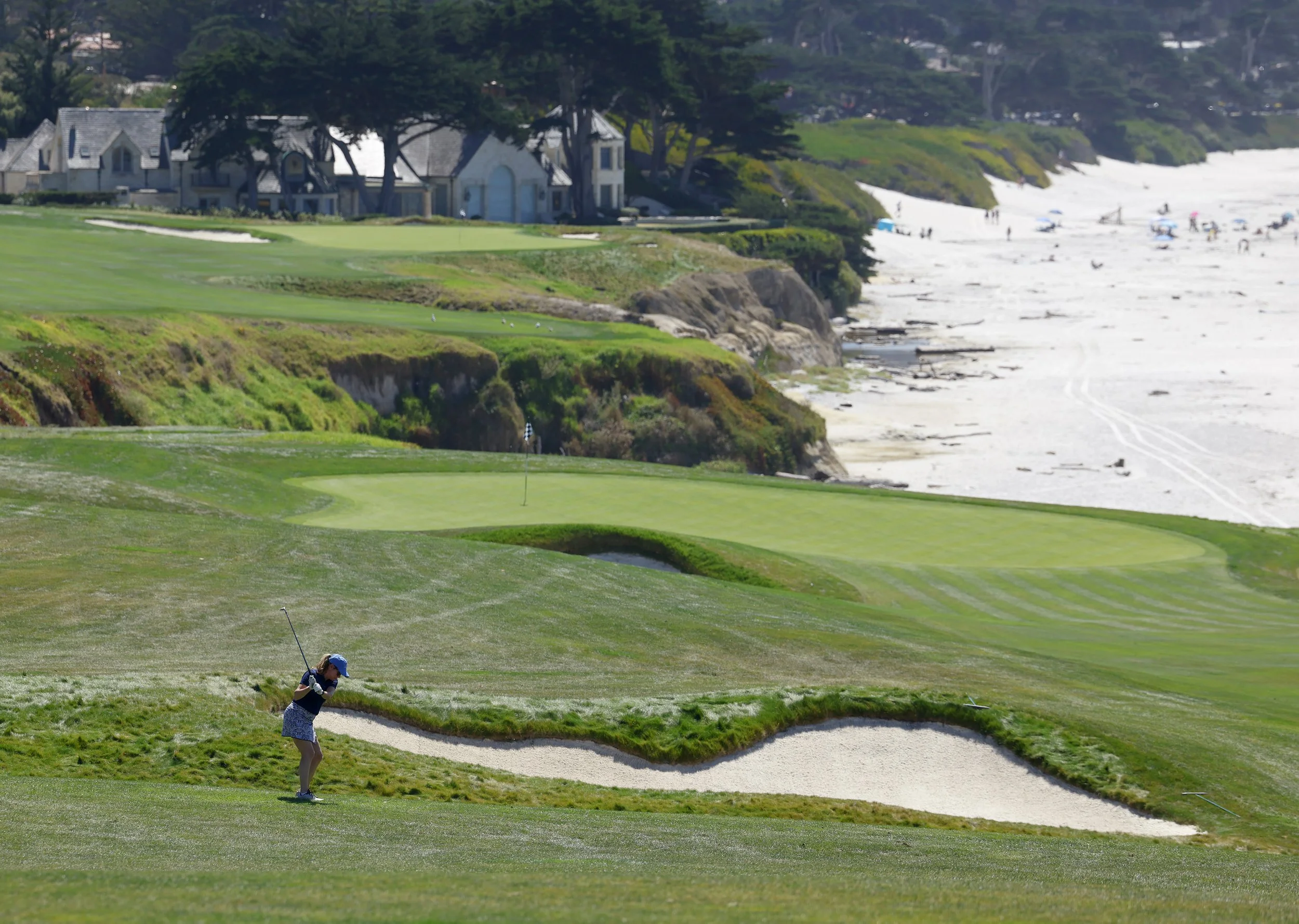 A golfer hots the ball from the fairway on the 10th hole at Pebble Beach Golf Links