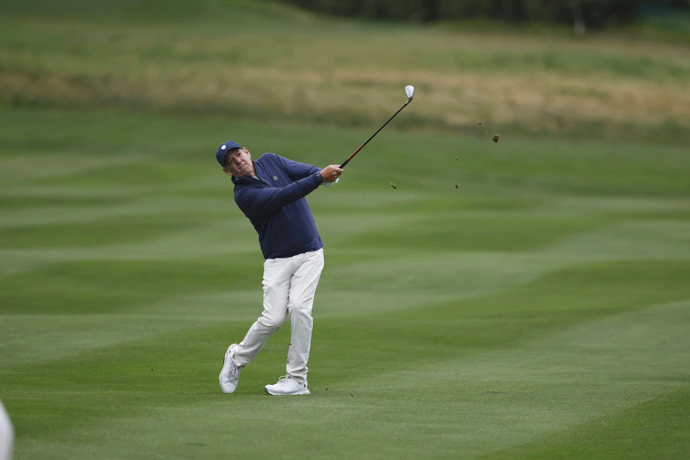 A golfer hits the ball from the fairway at pebble Beach Golf Links