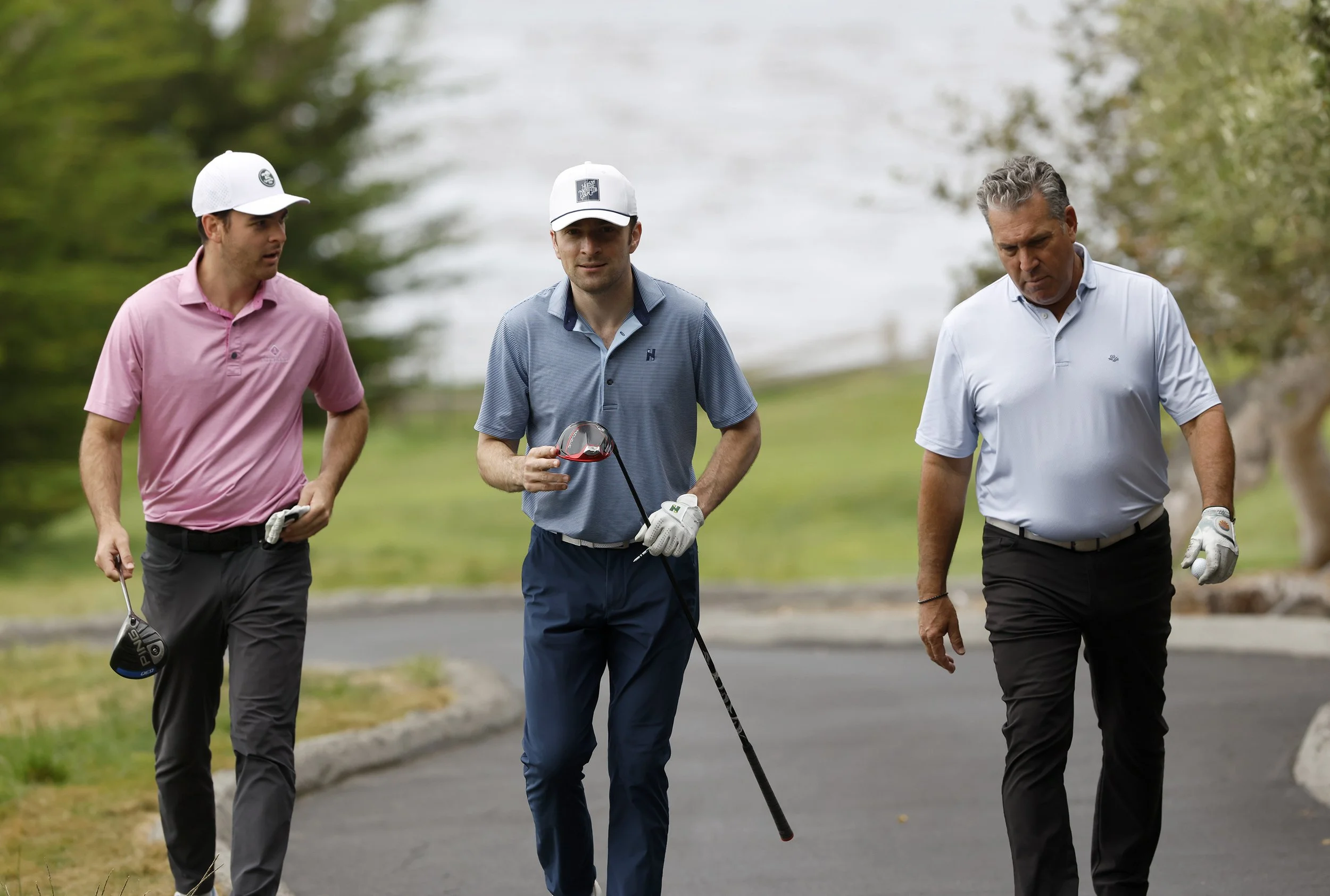 A group of golfer walk to the next at Pebble Beach Golf Links