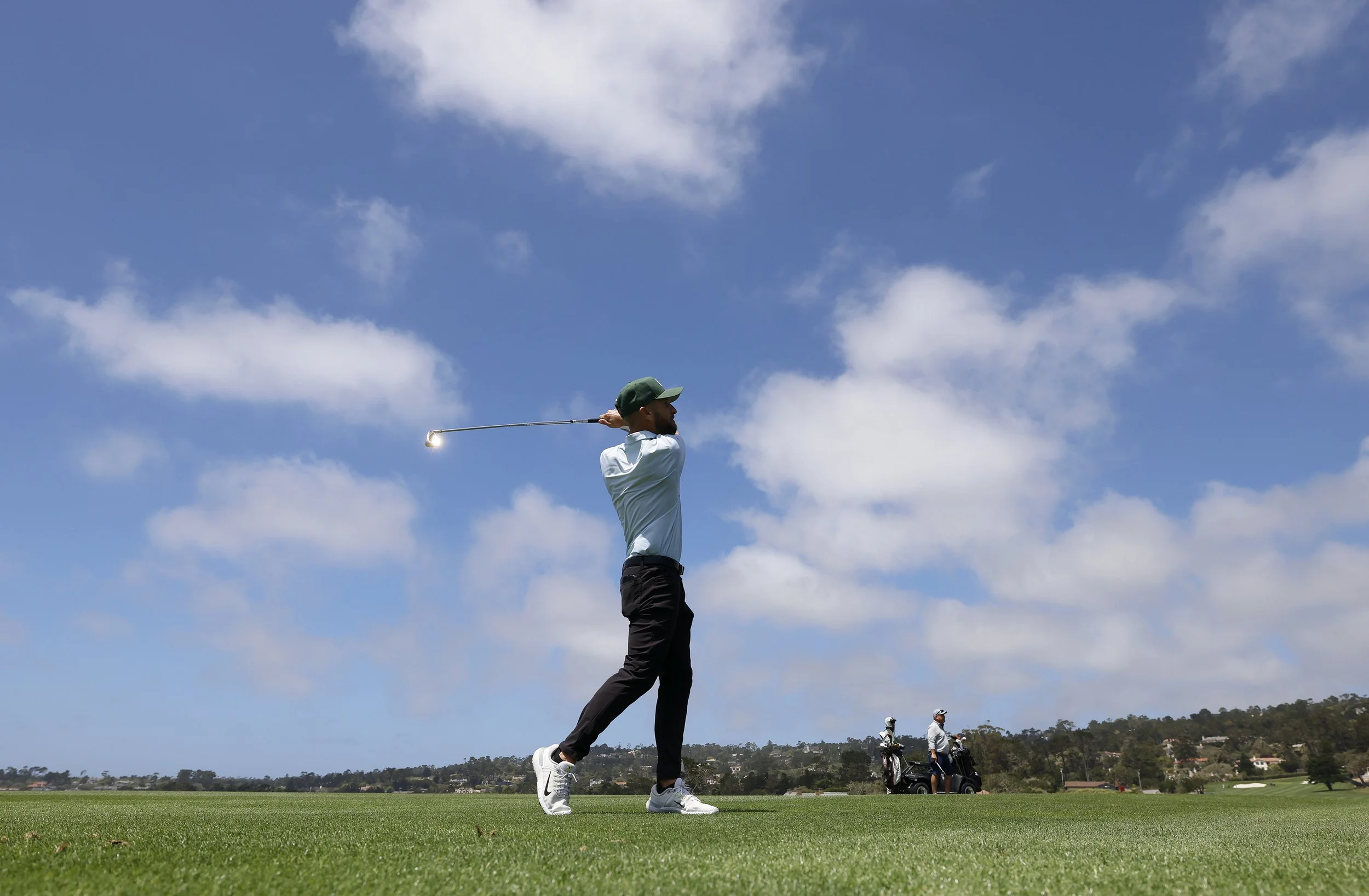 A golfer tees off at Pebble Beach Golf Links