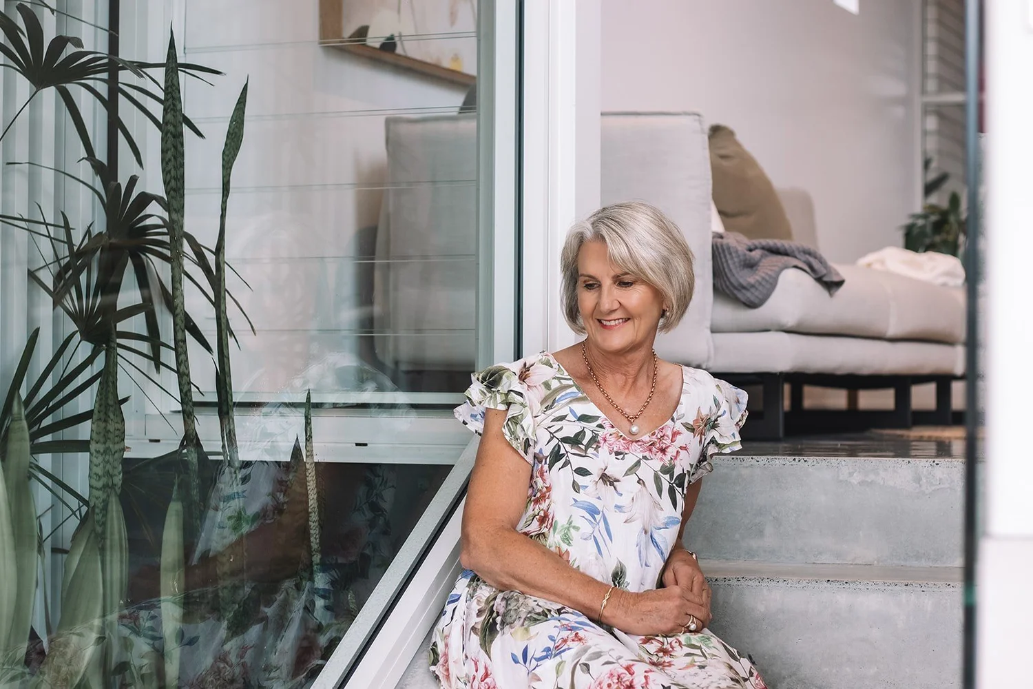 Diane Armstrong seated by a window