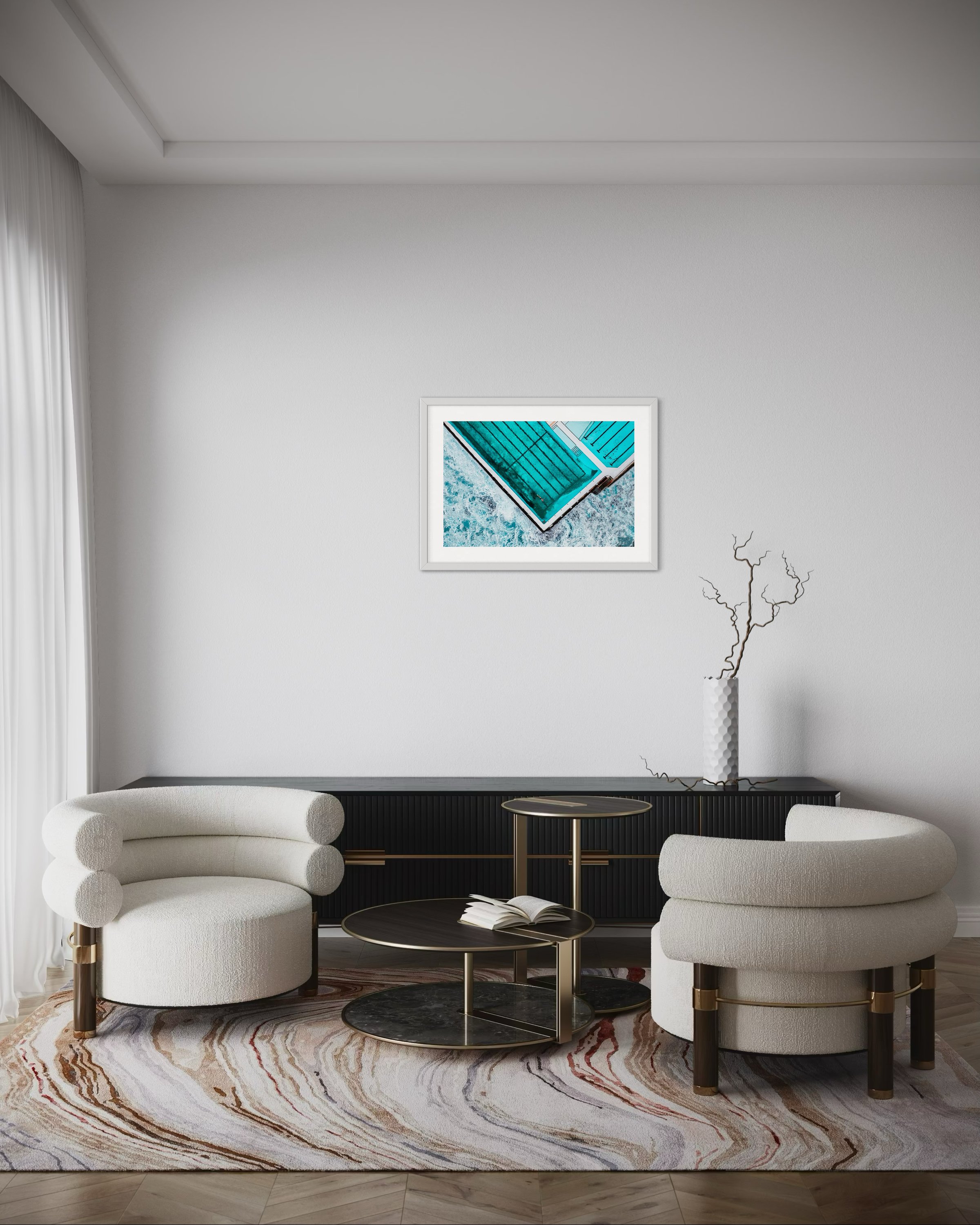 A landscape print in a frame in a lounge room for scale.