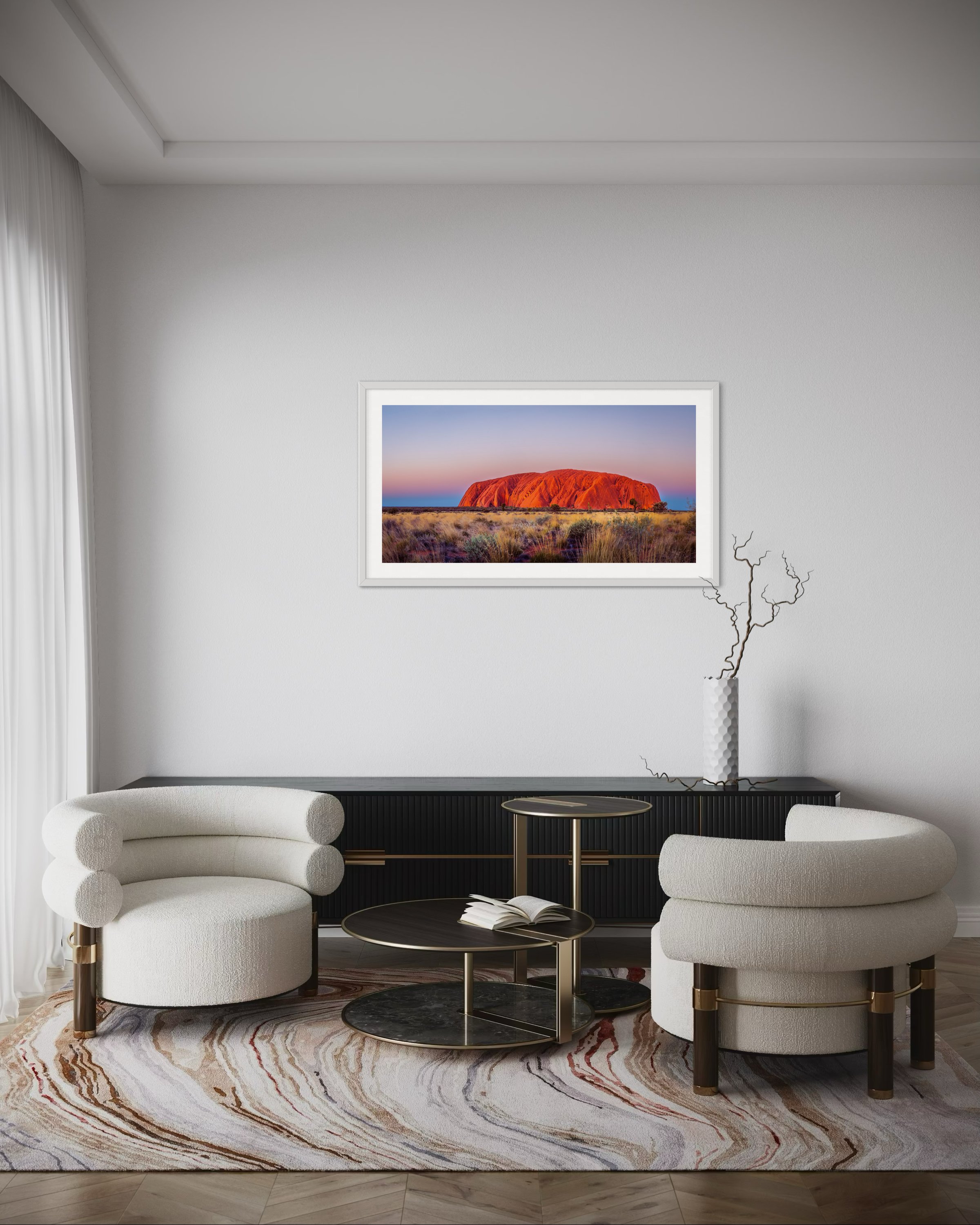 A large panoramic print in a frame in a lounge room for scale.