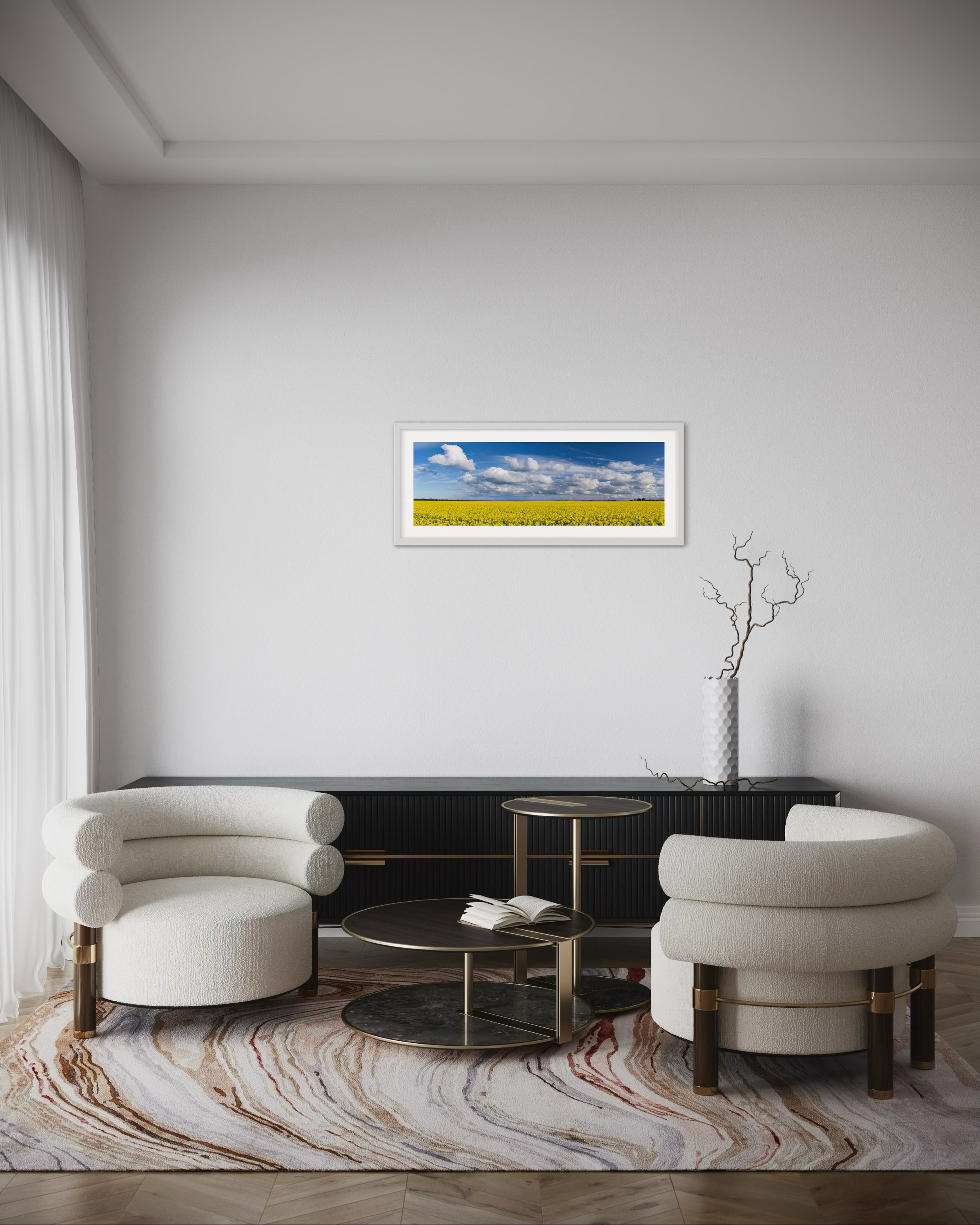 A medium panoramic print in a frame in a lounge room for scale.