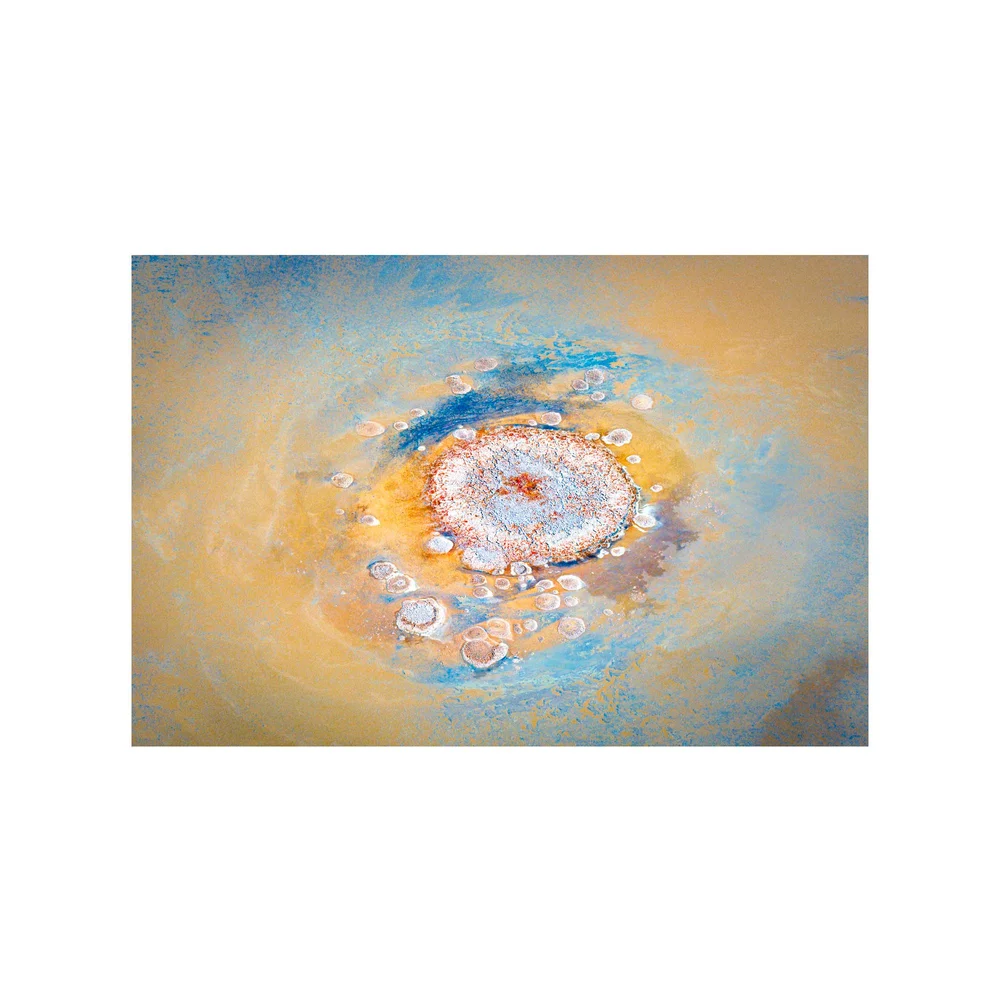 Salt Bloom: an aerial view of Kati Thanda, a flower of pink and ochre salt ringed by blue water