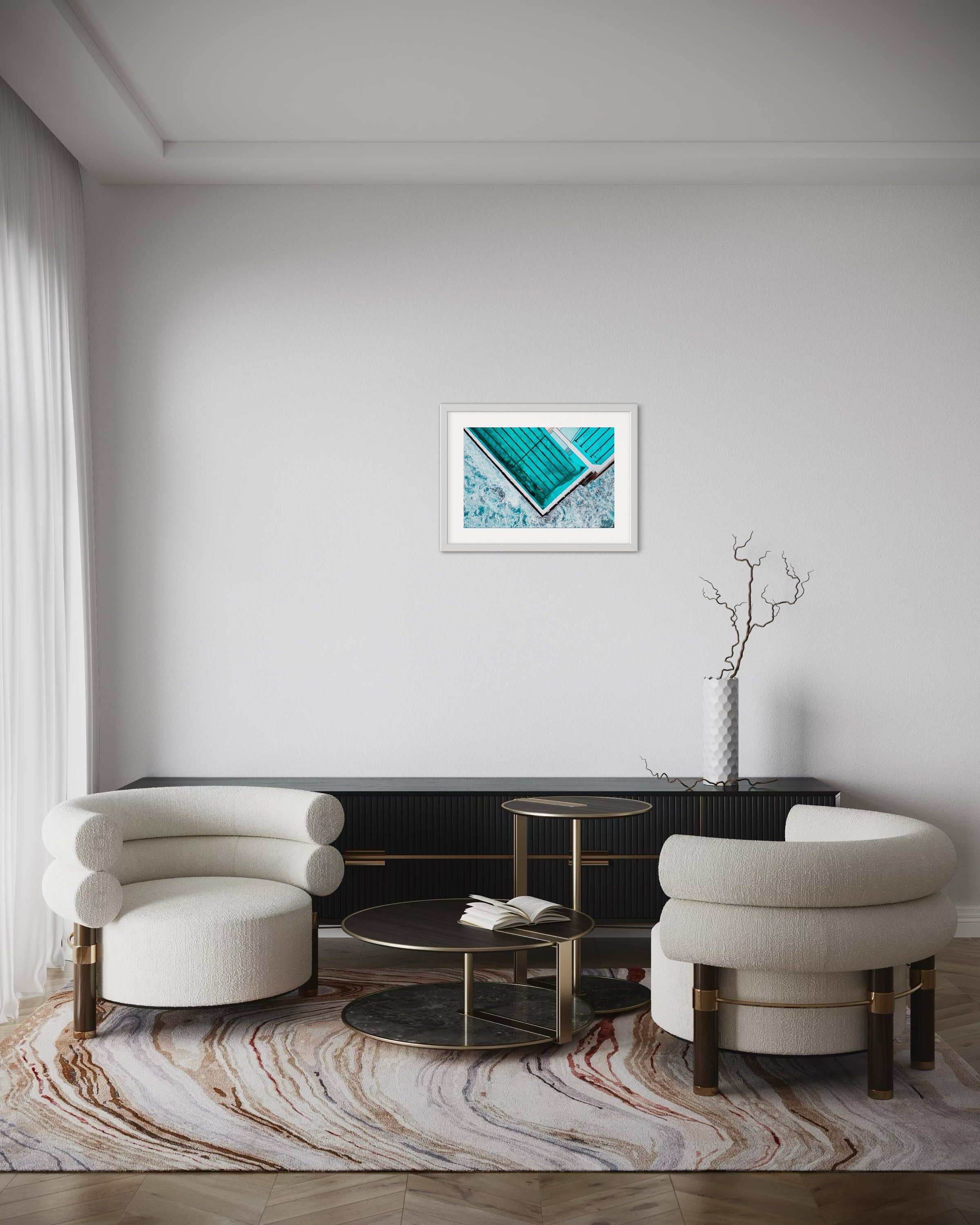 An medium landscape print in a frame in a lounge room for scale.