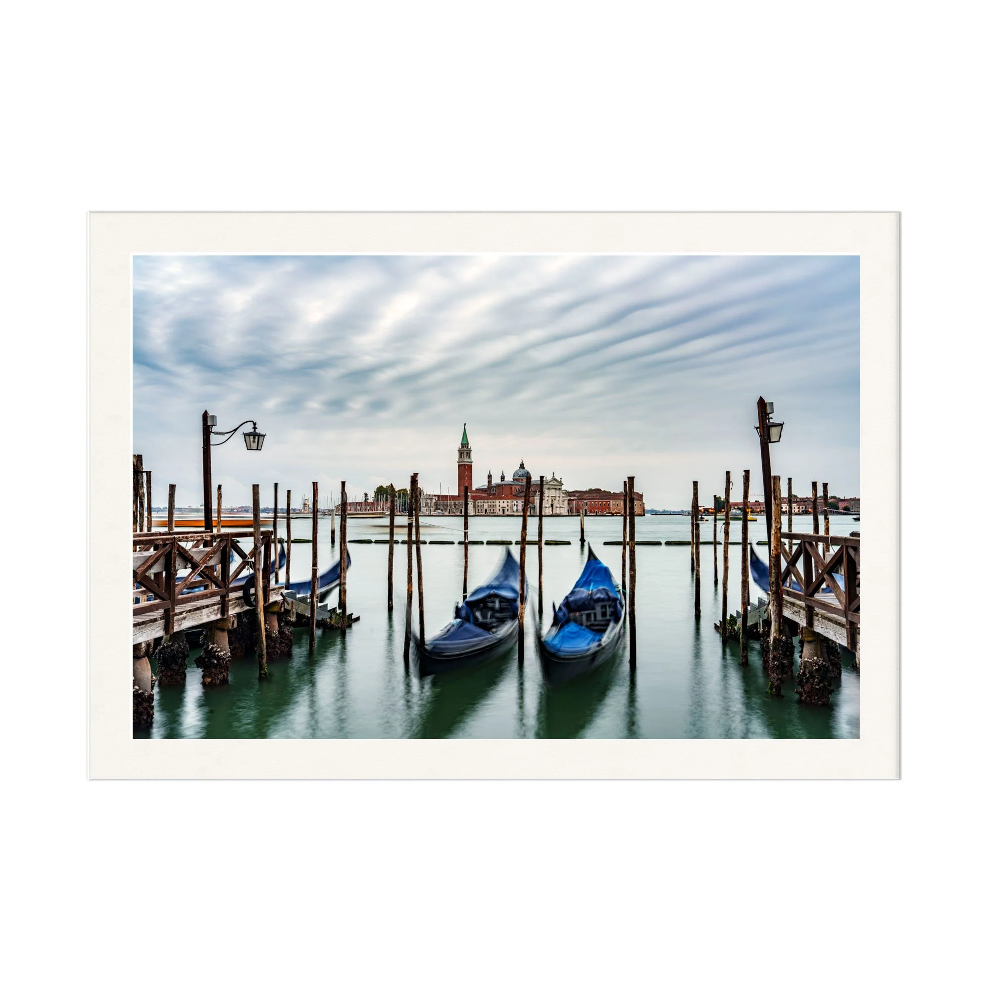 photograph of gondolas and Venice in stillness.