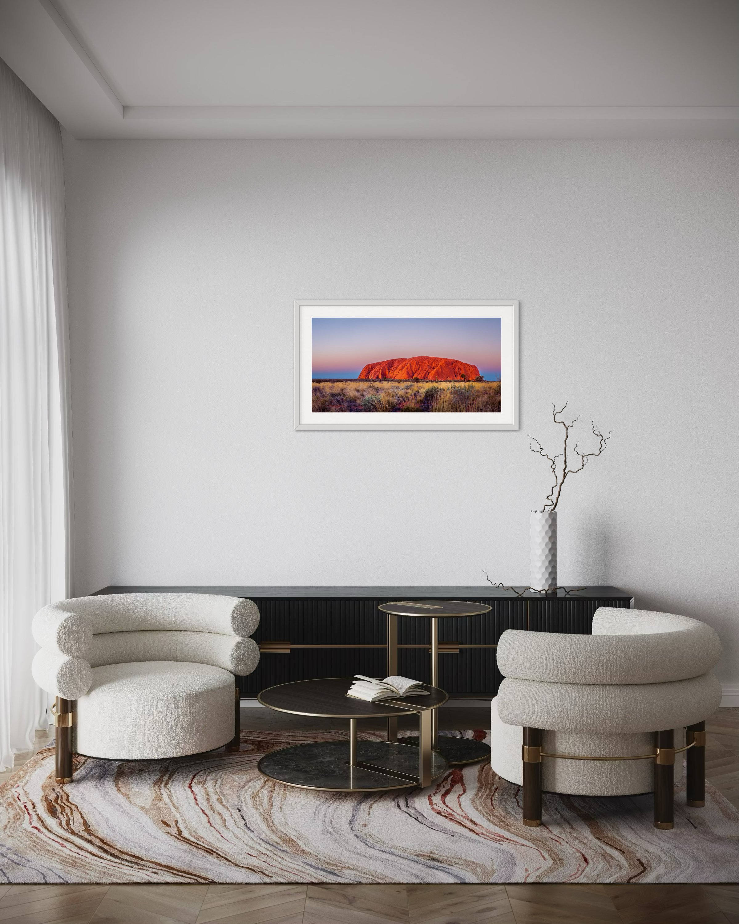 A medium panoramic print in a frame in a lounge room for scale.