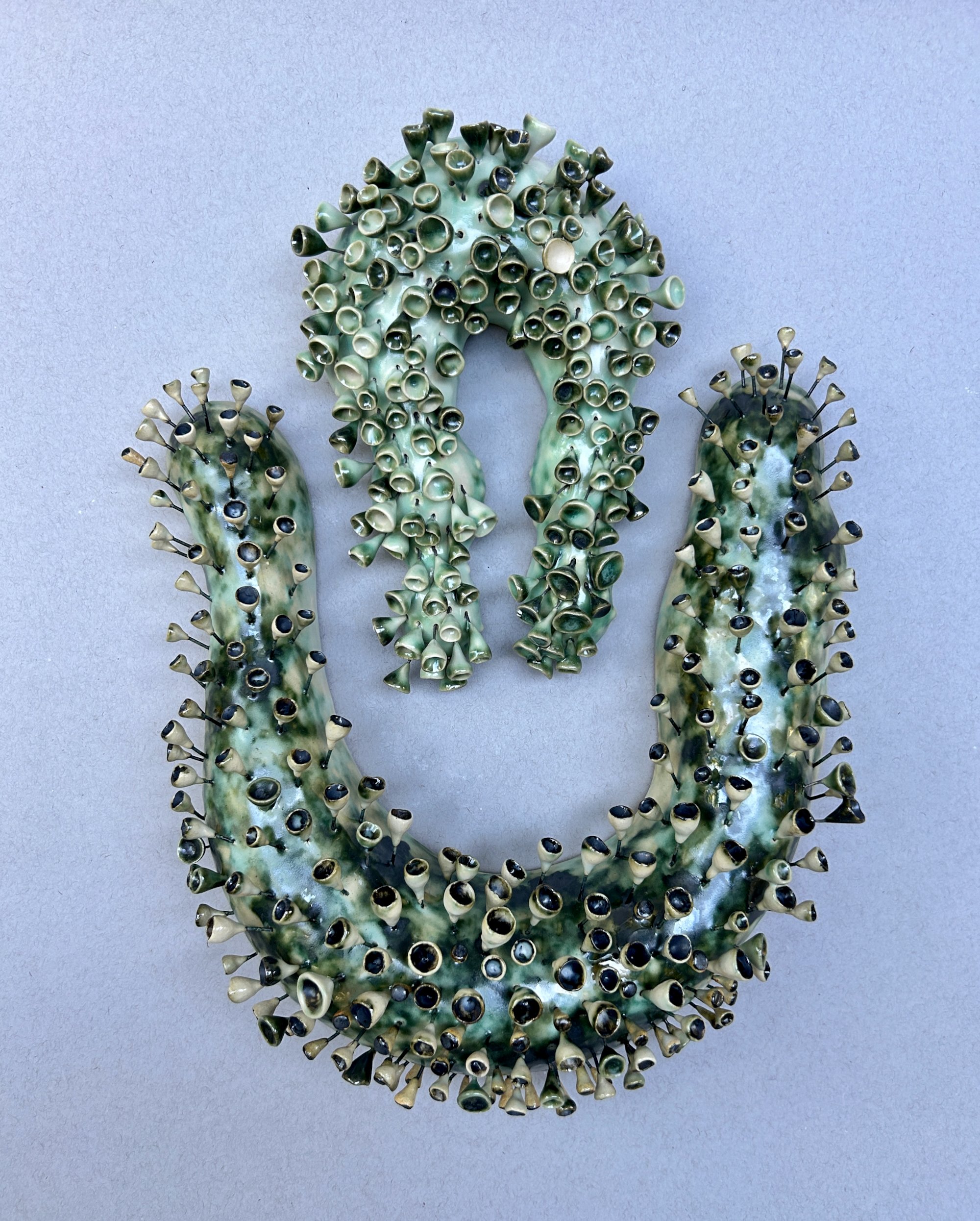 Nesting, ceramic, 18 x 12x 3”, 2024