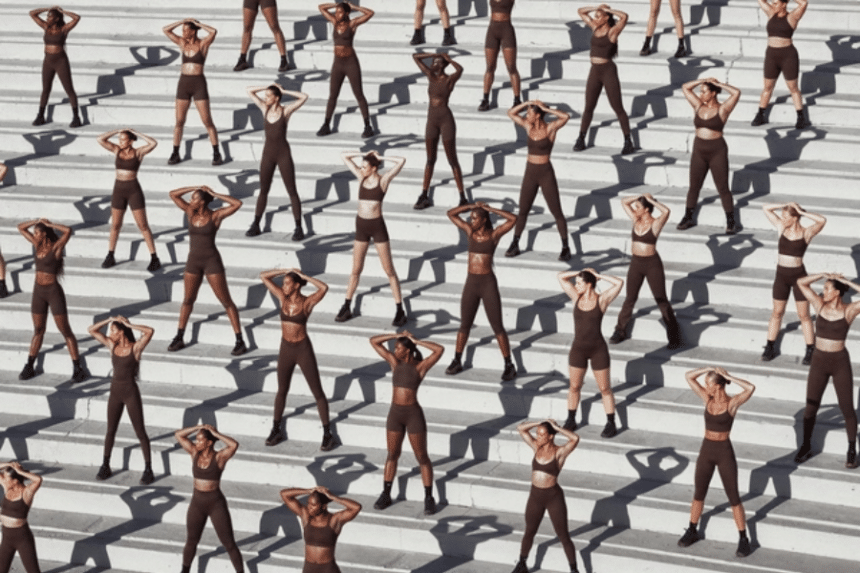 A number of models in neutral tone activewear for NikeSKIMS.