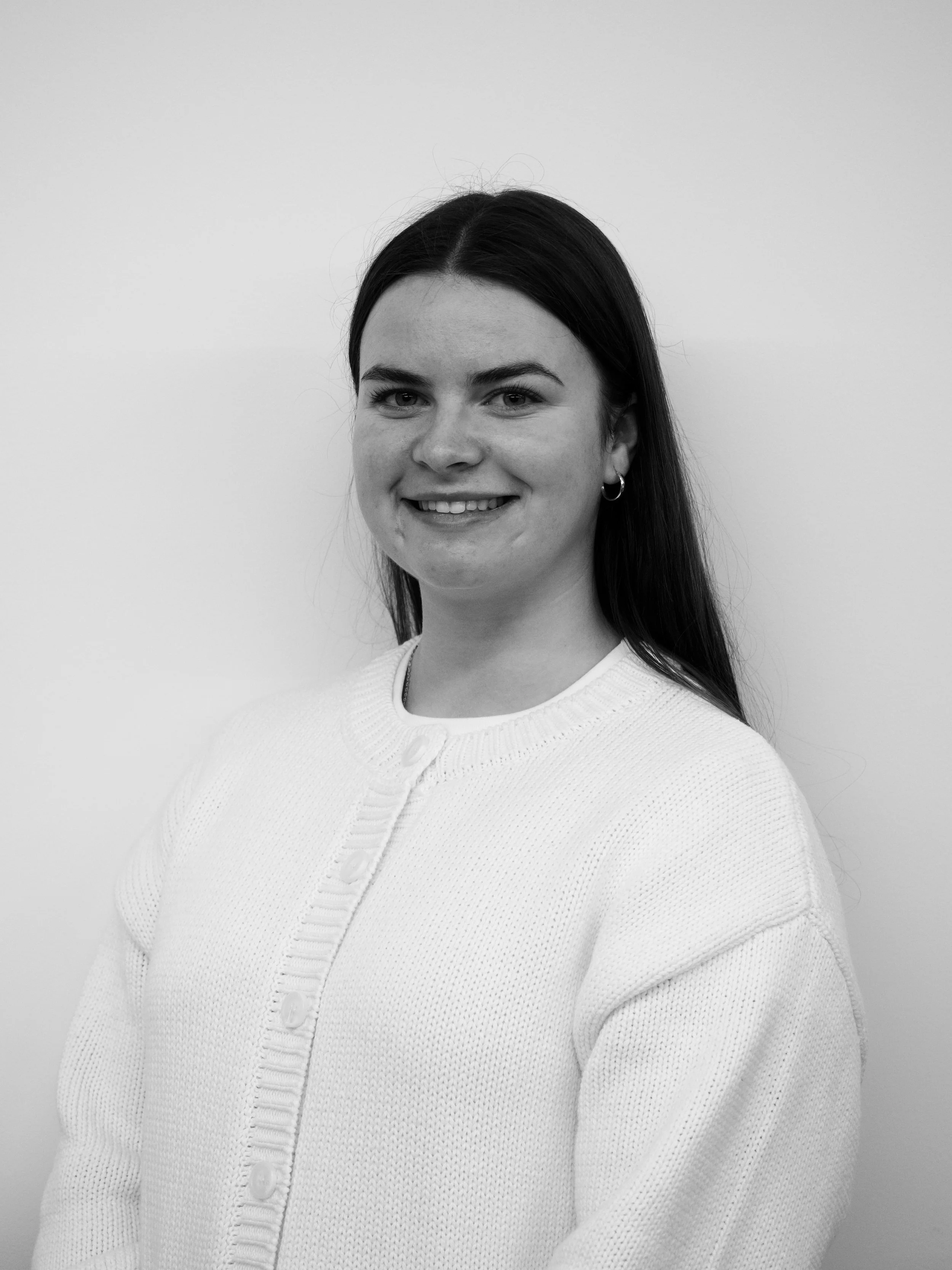 Pattern of stylized brain scan images, showing various cross-sections of brains in shades of gold and navy blue.