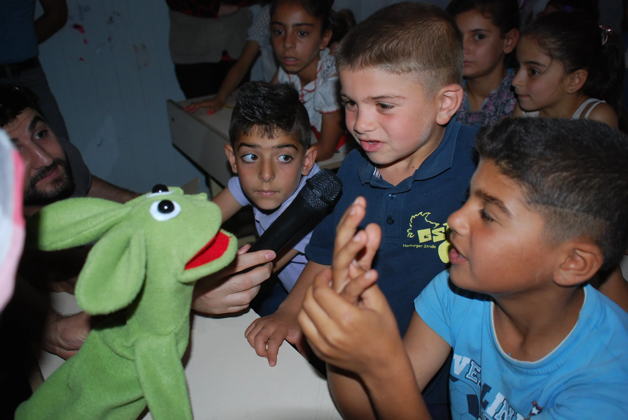 4. Iraq. Syrian refugee camp green puppet.JPG