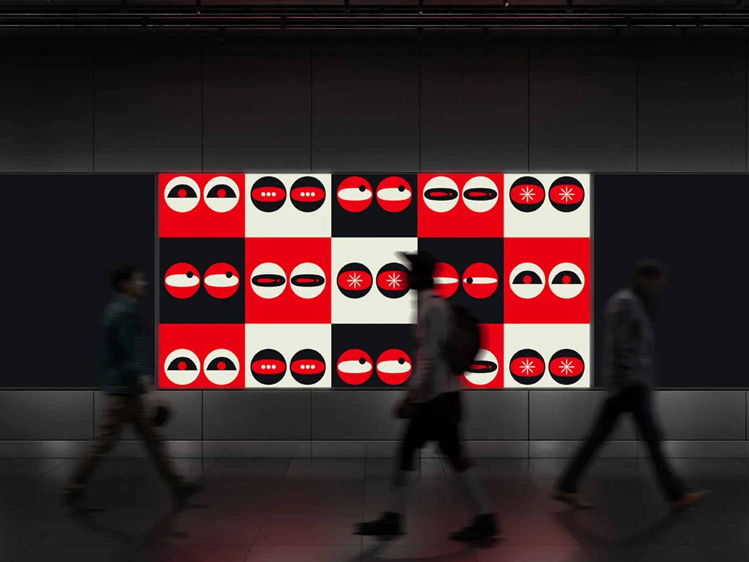 Artwork of abstract faces on a black and white checkered background in a subway or tunnel with three blurred pedestrians walking past.