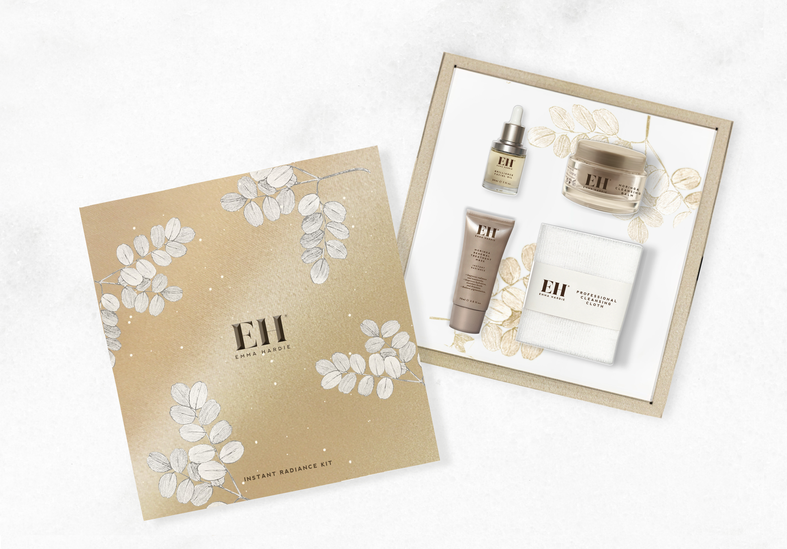 Beauty skincare products arranged on a white surface, including a dropper bottle, a small tube, a jar, and a cleansing cloth, with beige and white floral themed packaging and materials.