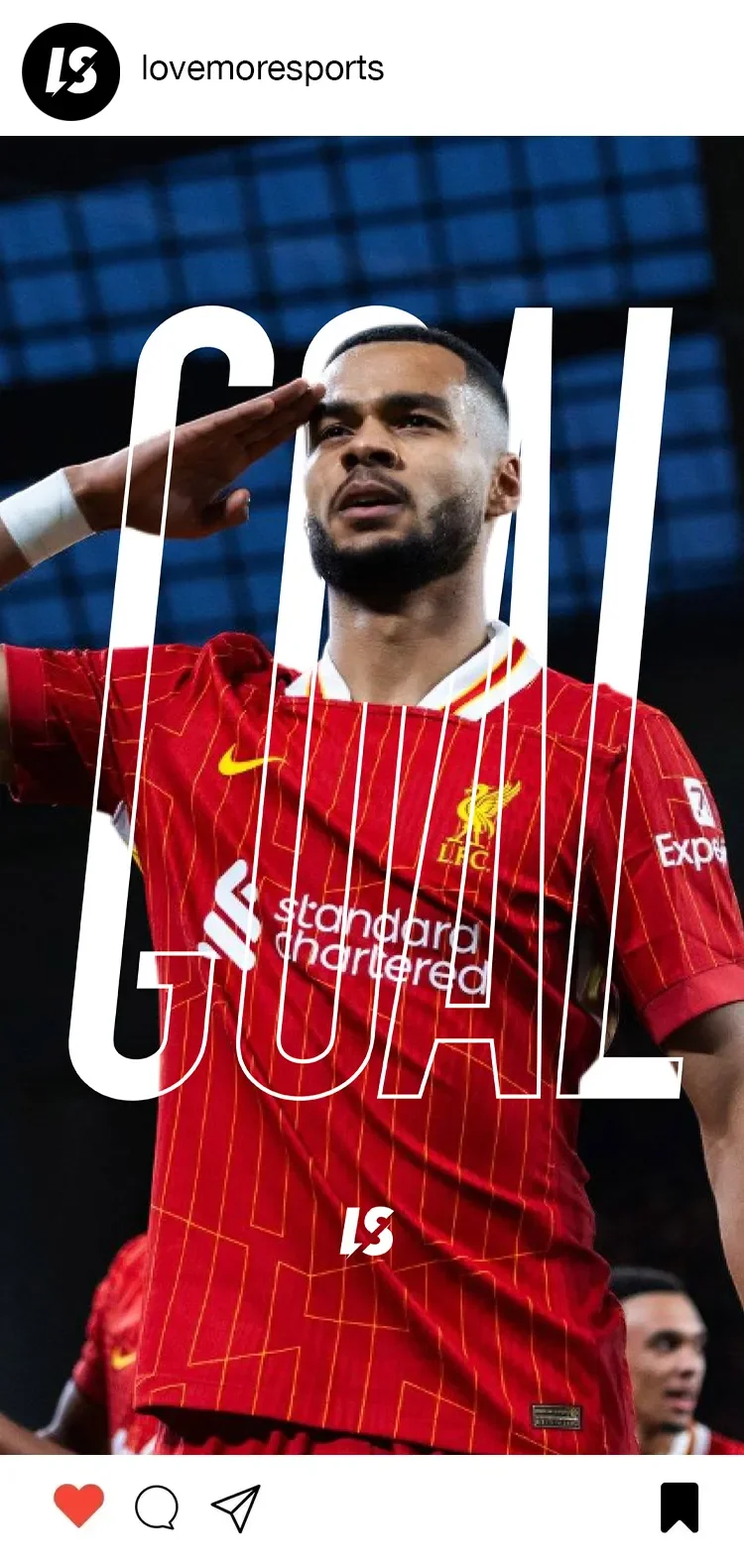 A soccer player wearing a red Liverpool FC jersey saluting during a match, with the word "GOAL" overlaid.