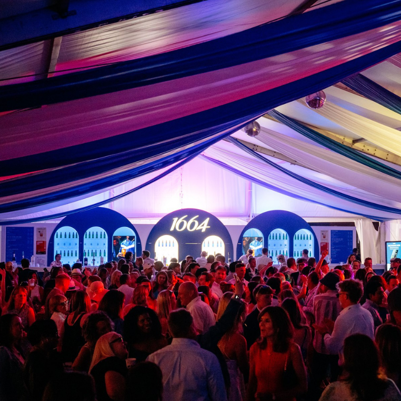 Elderly women in colorful outfits enjoying a party