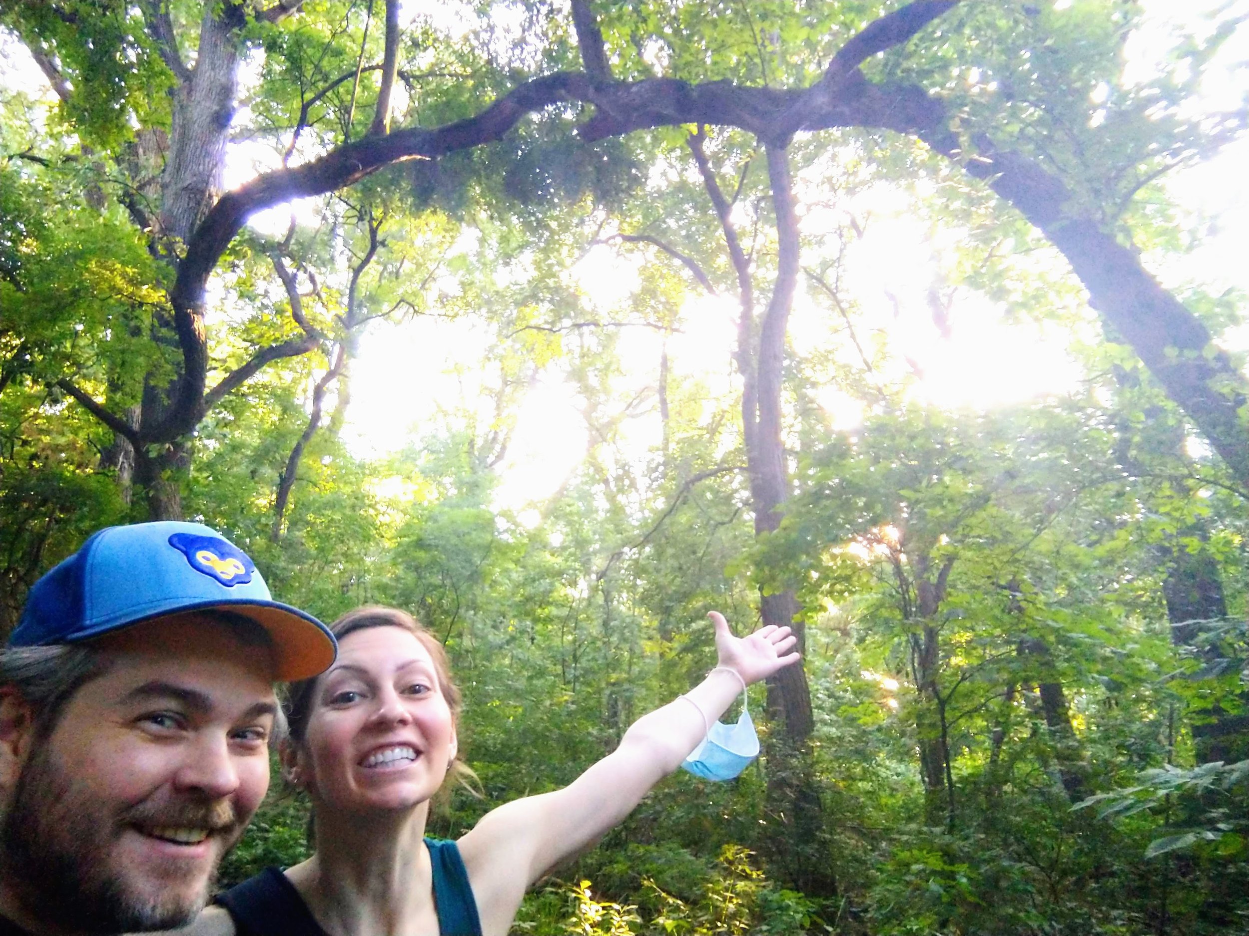 Picture of Juliet and Jon by the trees in their neighborhood