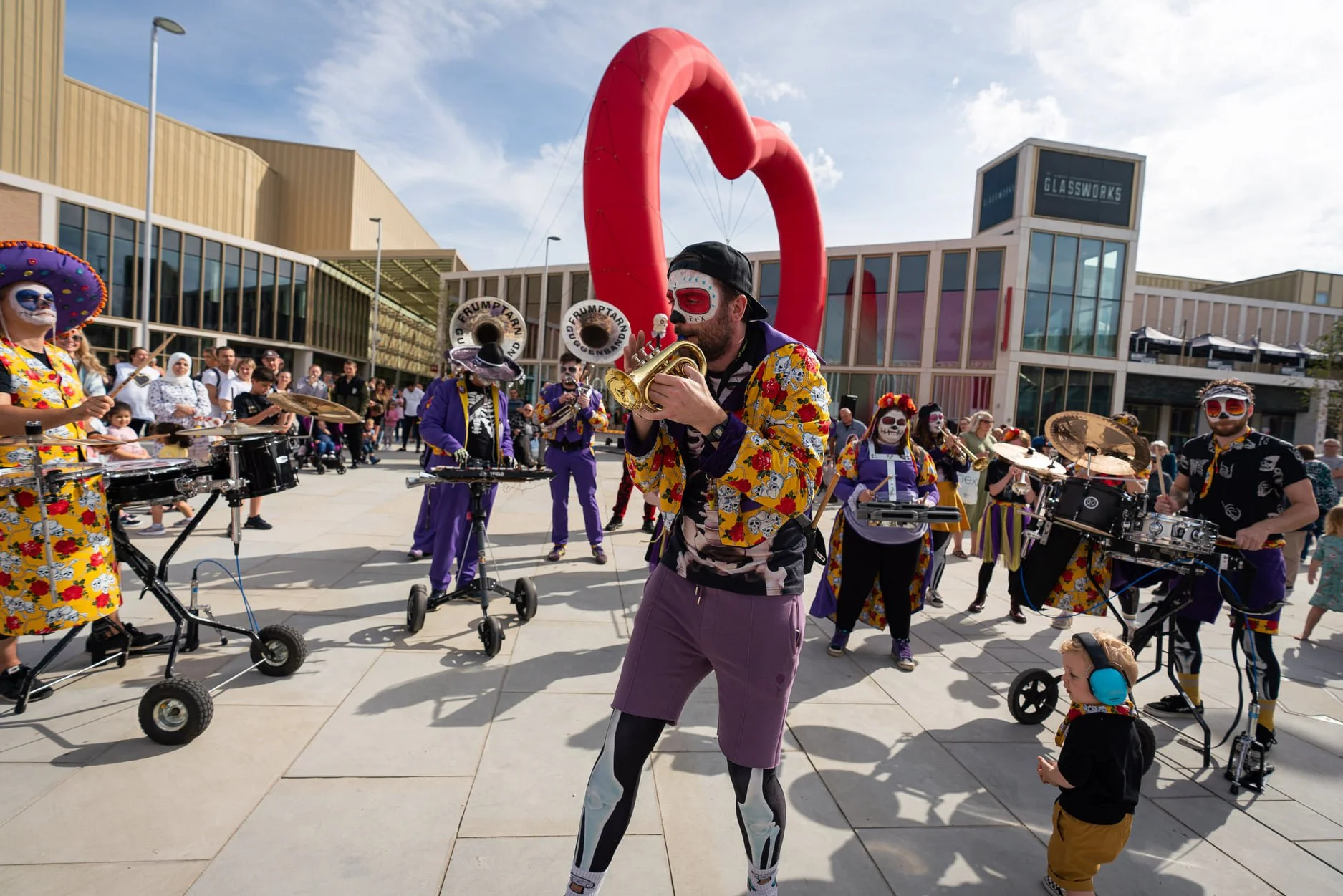 festival performers play trumpets in barnsley town centre