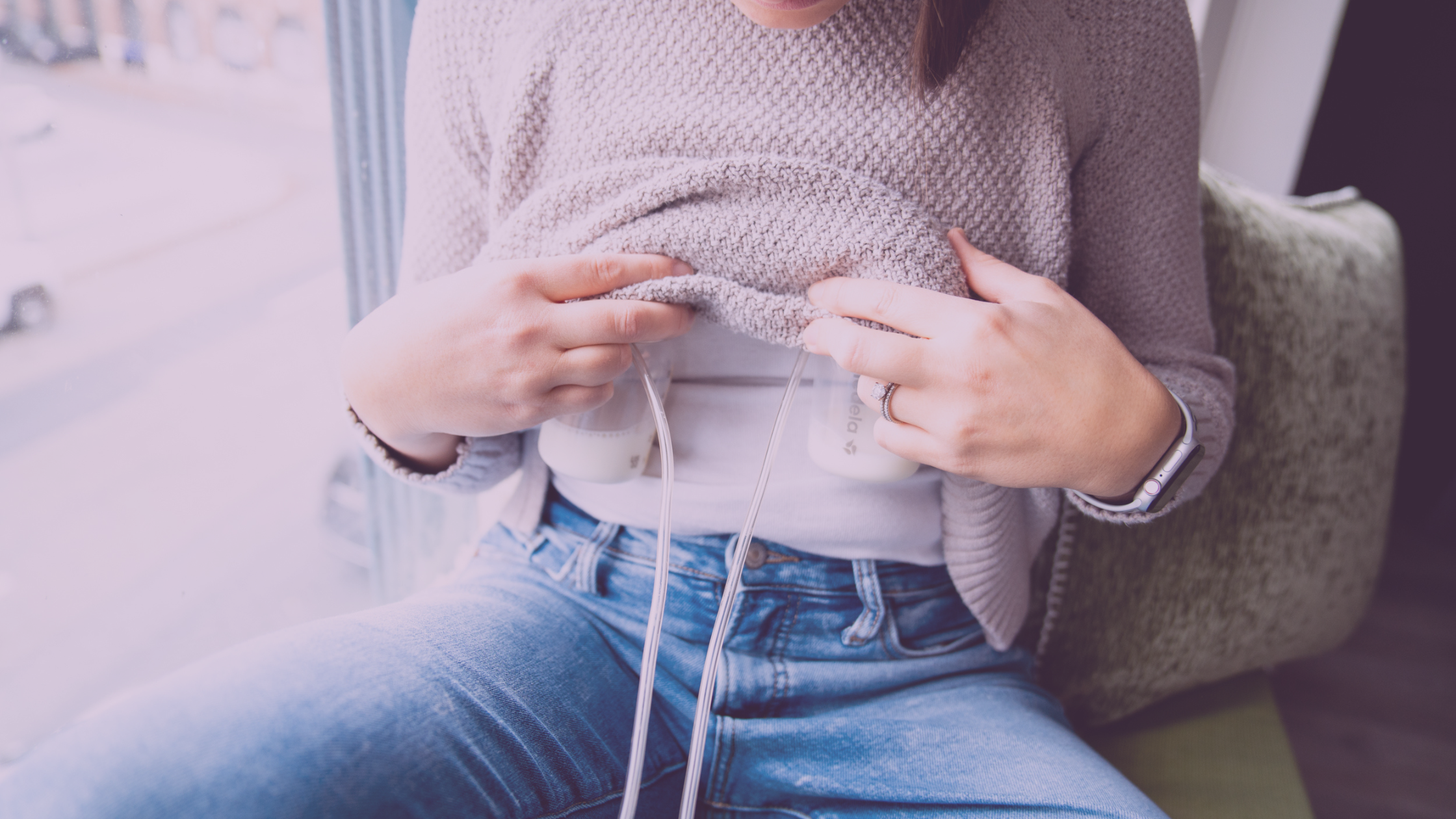 Mom sitting with breast pumps attached for breastmilk lactation