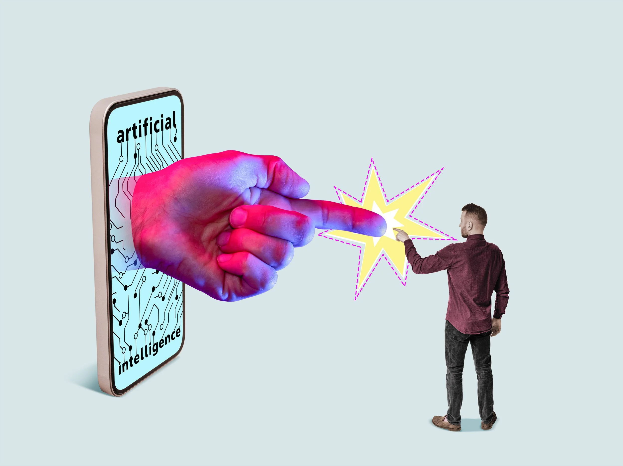 A large, colorful, robotic hand extending out of a smartphone screen labeled 'artificial intelligence', pointing at a man who is touching a bright, comic-style explosion graphic. The background is light blue.
