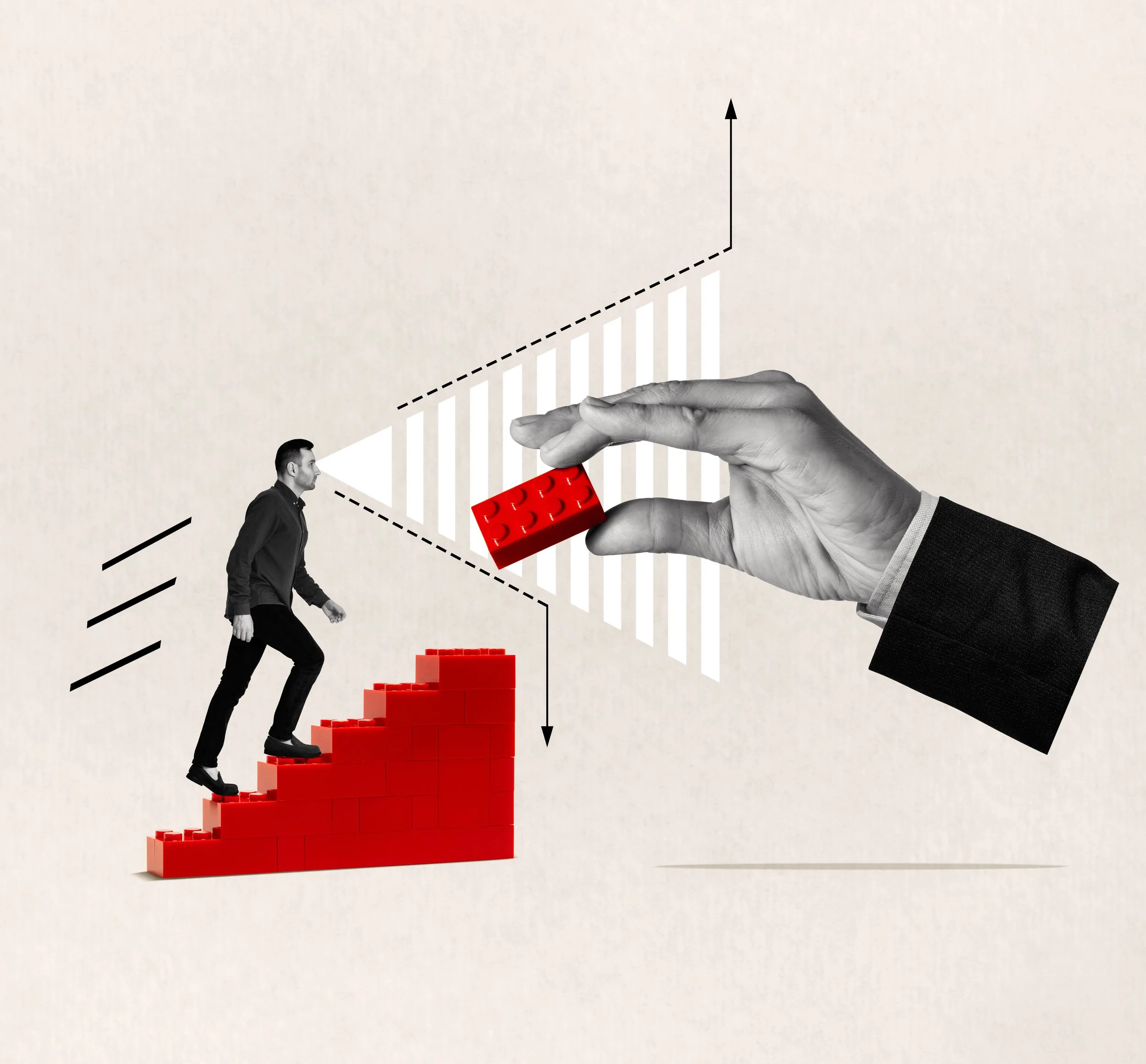 A businessman climbing a red staircase made of building blocks, with a large hand holding a red building block in front of a graph with upward and downward trends.